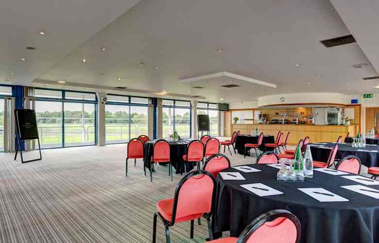 Nottingham Racecourse event space with round tables, ideal for corporate meetings and gatherings.