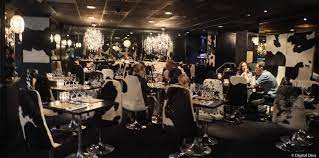 Private wine room in Leeds with cow-themed decor, perfect for events and meetings.