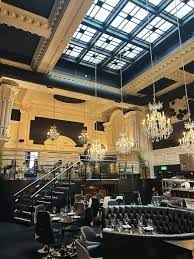 Elegant private wine room in Leeds with chandeliers, perfect for upscale events.