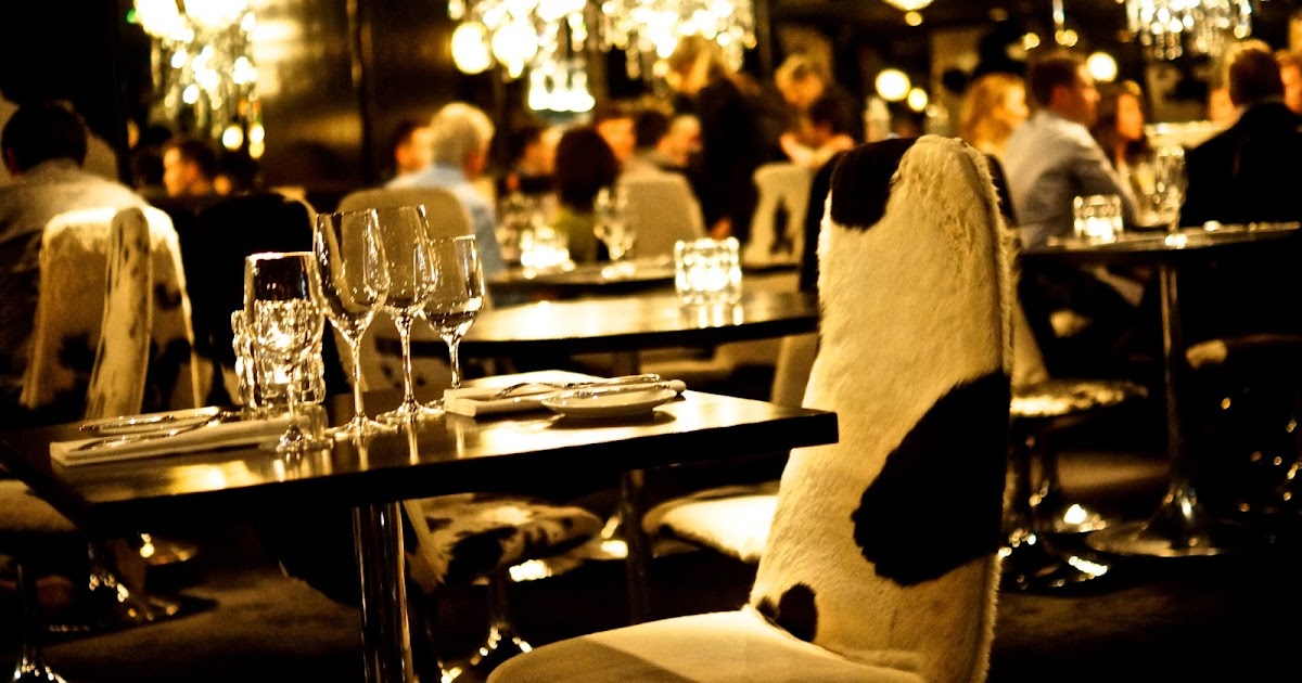 Stylish dining space with cowhide chairs, ideal for corporate dinners and upscale events.