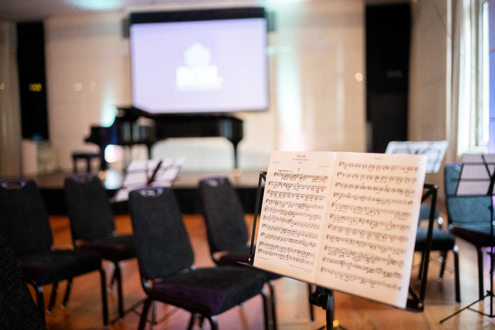 Princess Alexandra Hall with grand piano, ideal for musical performances and presentations.