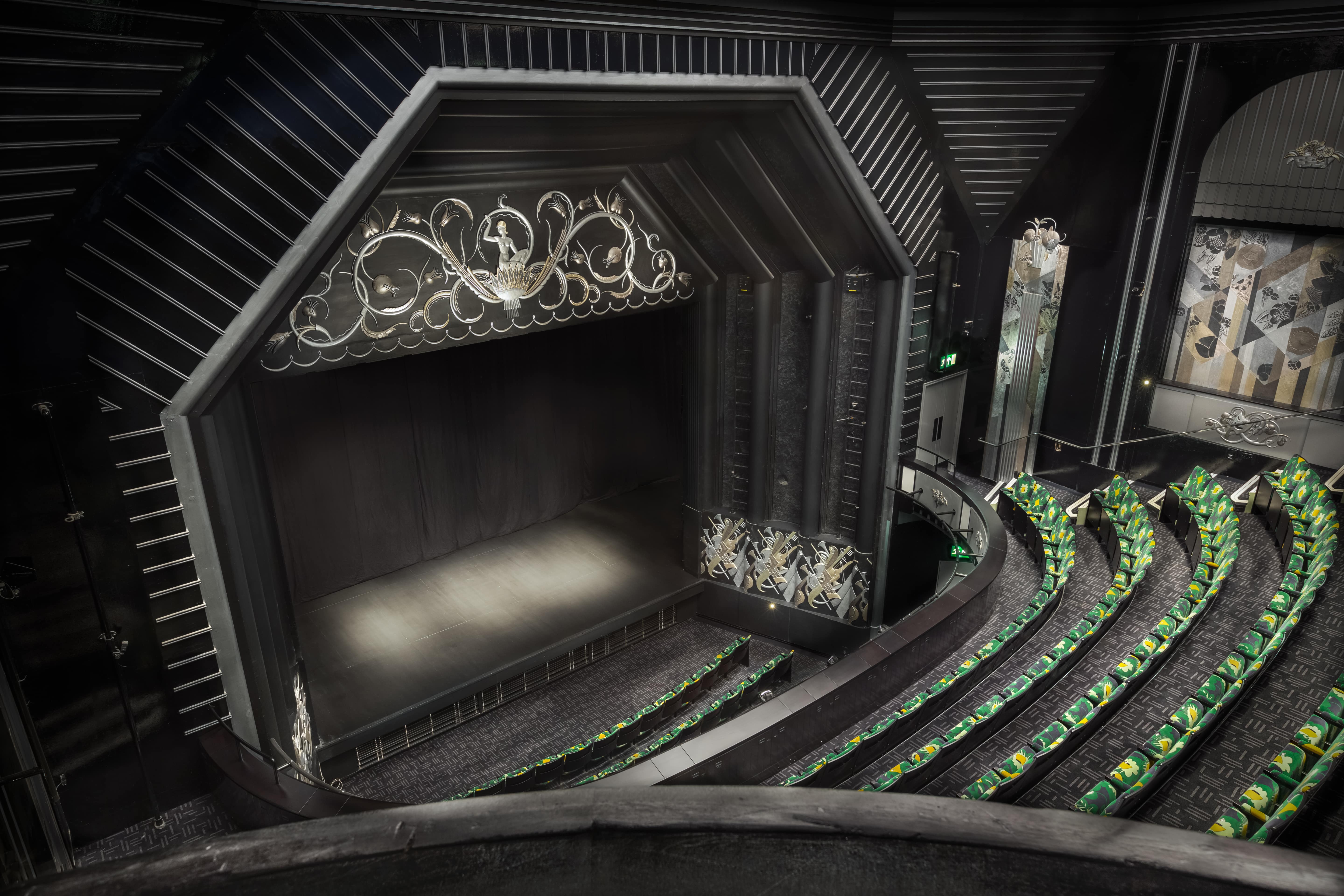 Trafalgar Theatre auditorium with elegant stage and tiered seating for events and performances.