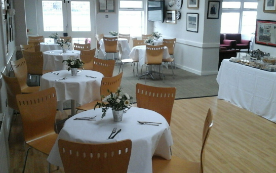 Trafalgar Rowing Centre event space with round tables, ideal for meetings and gatherings.