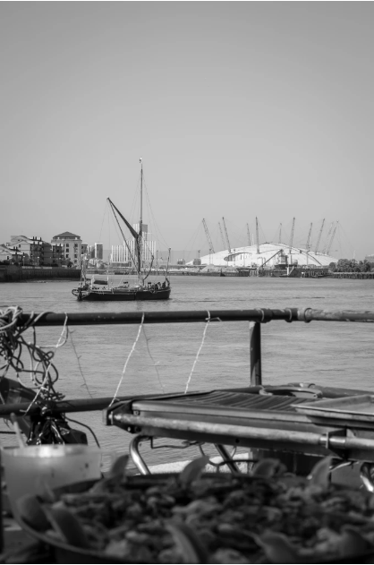 Trafalgar Rowing Centre waterfront venue with traditional boat, ideal for outdoor events.