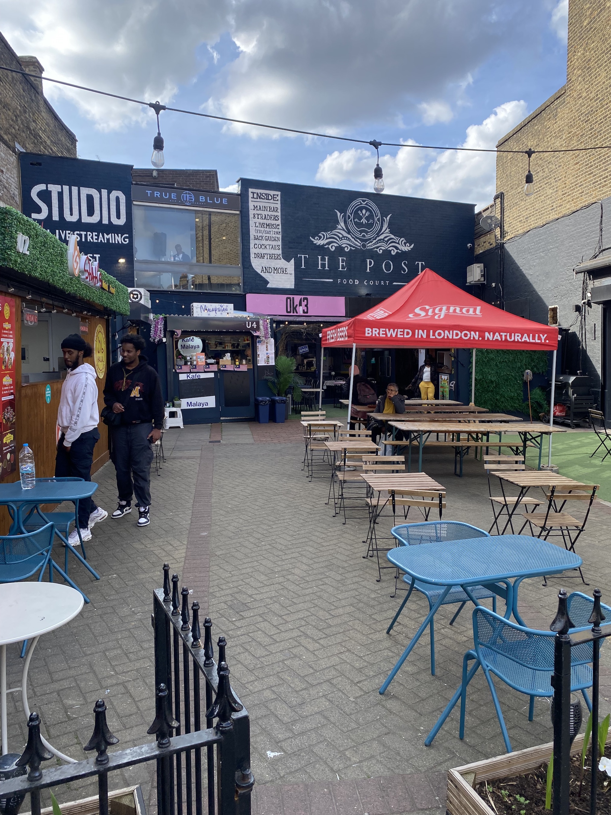Vibrant outdoor event space with food stalls for community festivals and pop-up events.