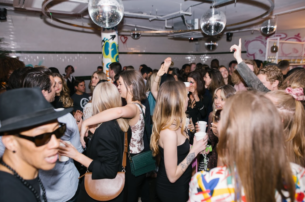 Vibrant social event at Unique Events - The Lounge with disco balls, ideal for parties.