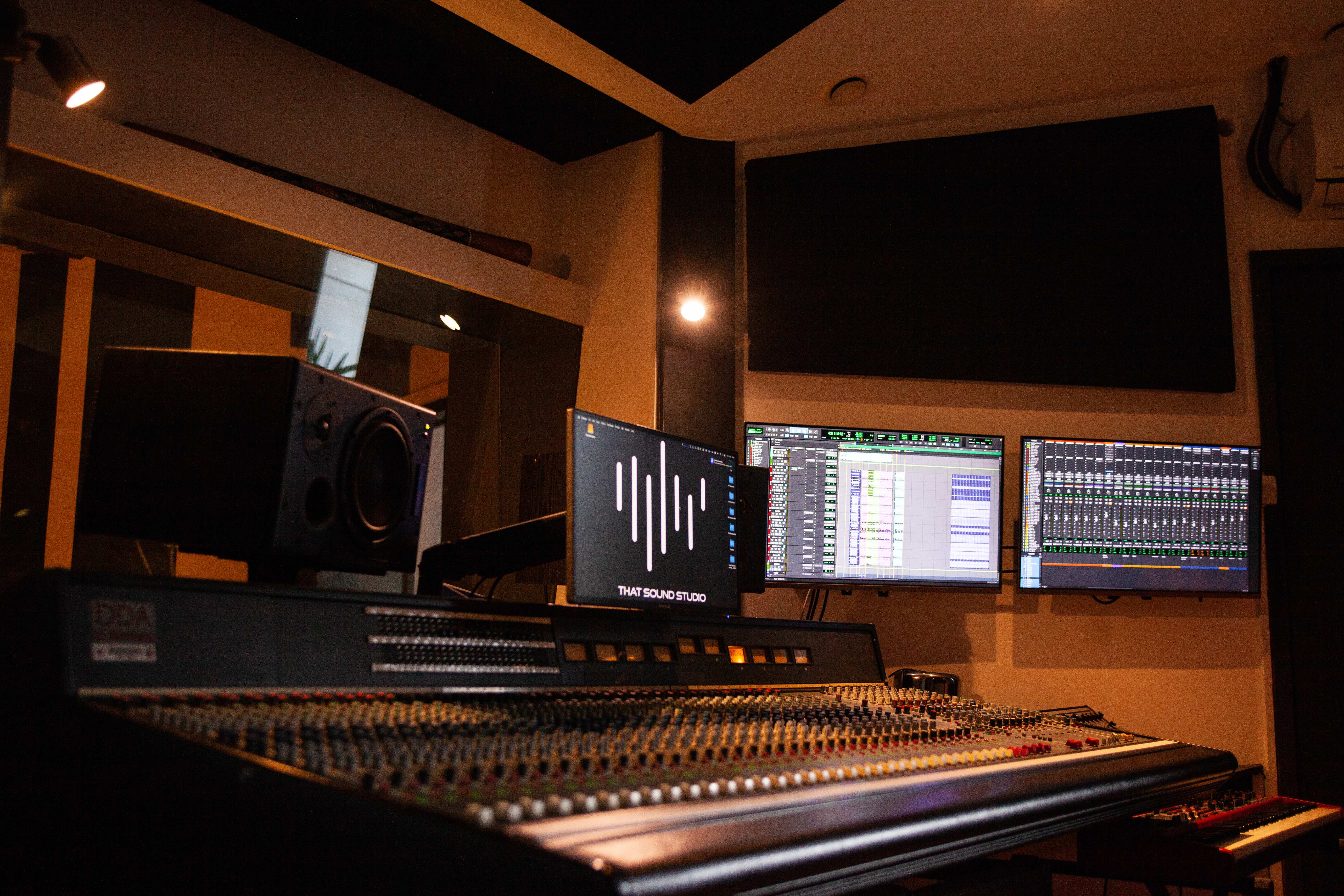Professional audio mixing studio with monitors for live event sound production.
