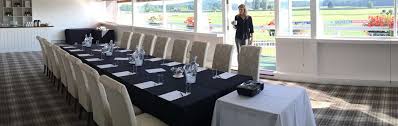 Meetings at Market Rasen Racecourse with elegant table setup and natural light.