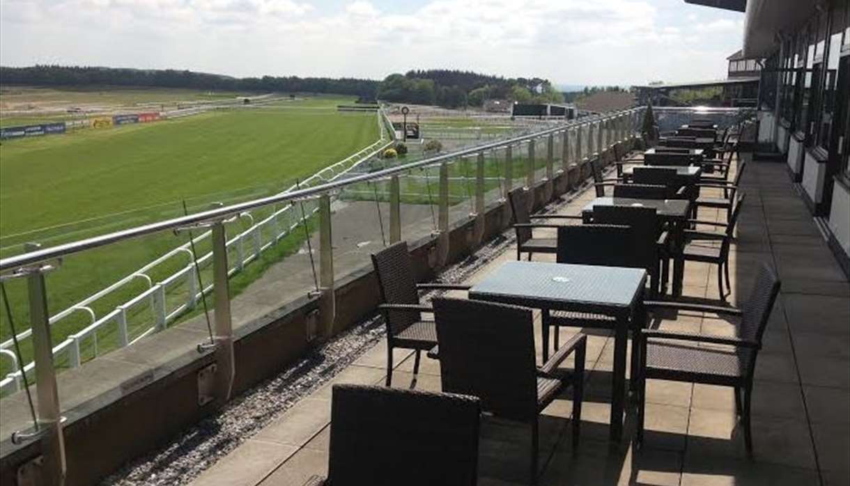 Exeter Racecourse terrace with modern seating, ideal for events and networking.