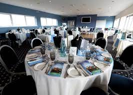 Formal meeting setup at Wincanton Racecourse with elegant table settings for networking.