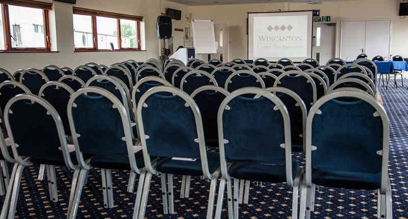 Meeting space at Wincanton Racecourse with organized chairs for seminars and workshops.