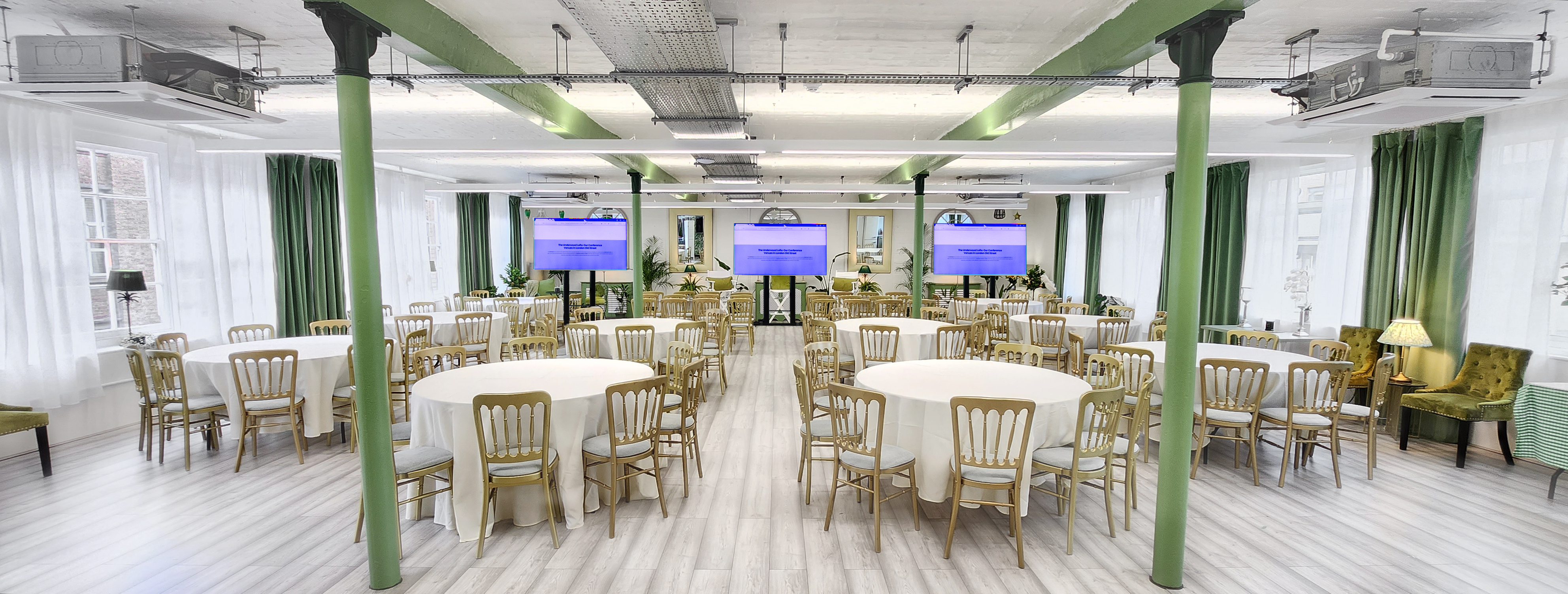 Versatile event space with round tables, ideal for meetings and networking events.