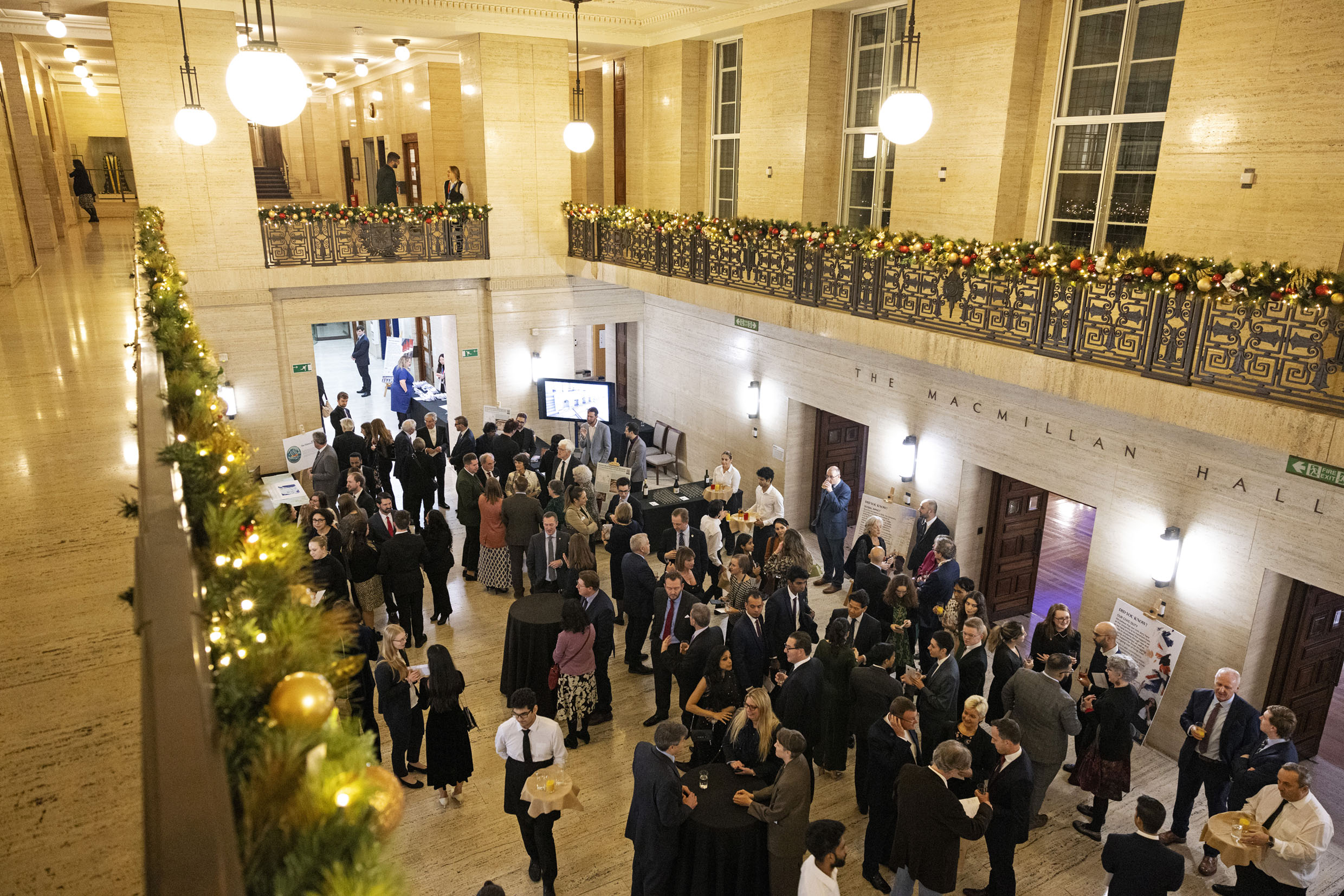 "Senate House Christmas party at University of London, elegant decor and networking atmosphere."