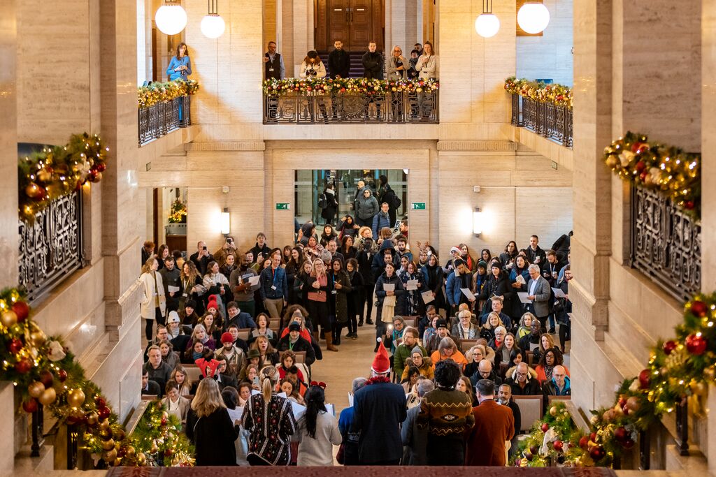 "Senate House Christmas party at University of London, festive decor and networking atmosphere."