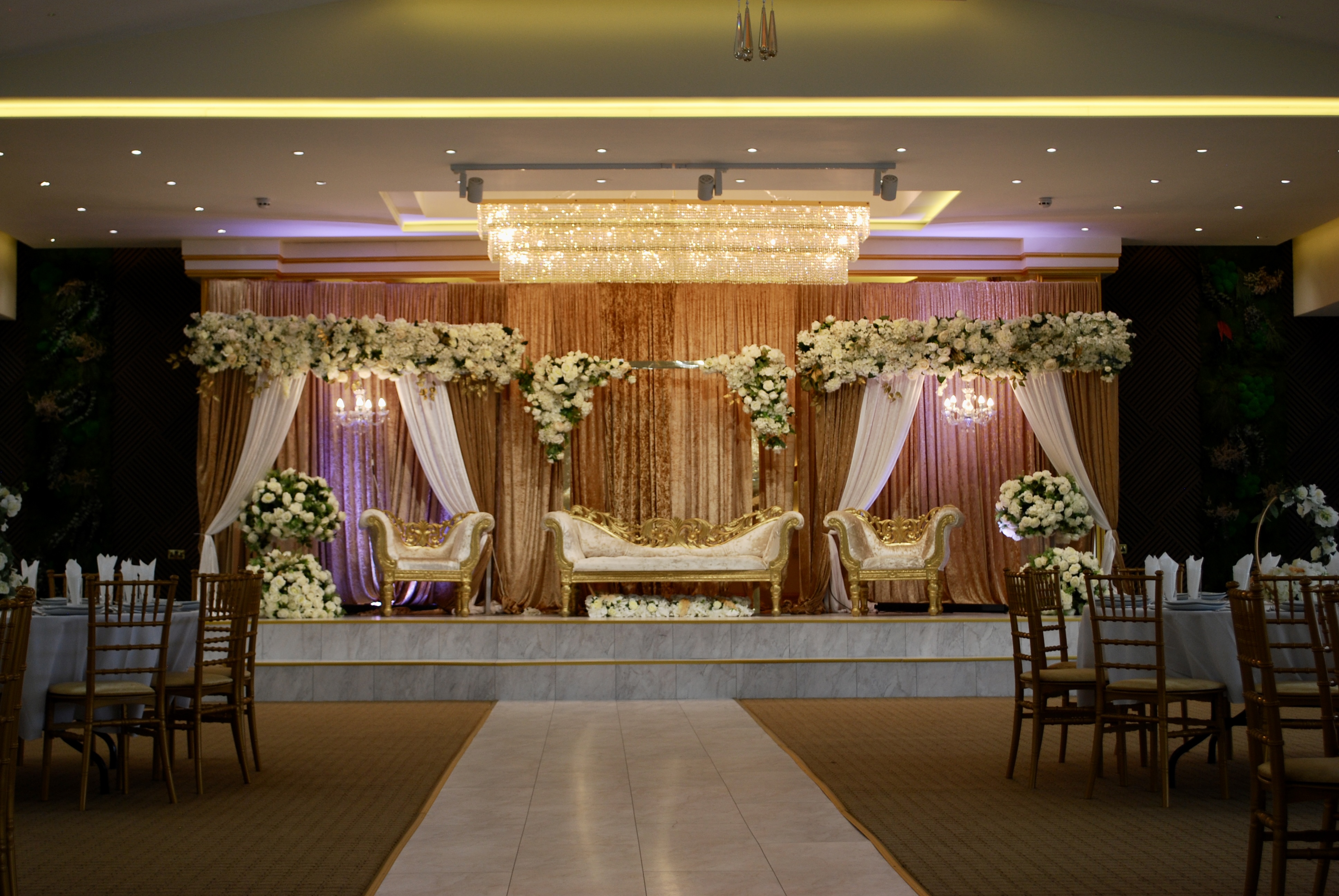 Elegant Main Hall in Crystal Suite, perfect for weddings and upscale events with floral decor.