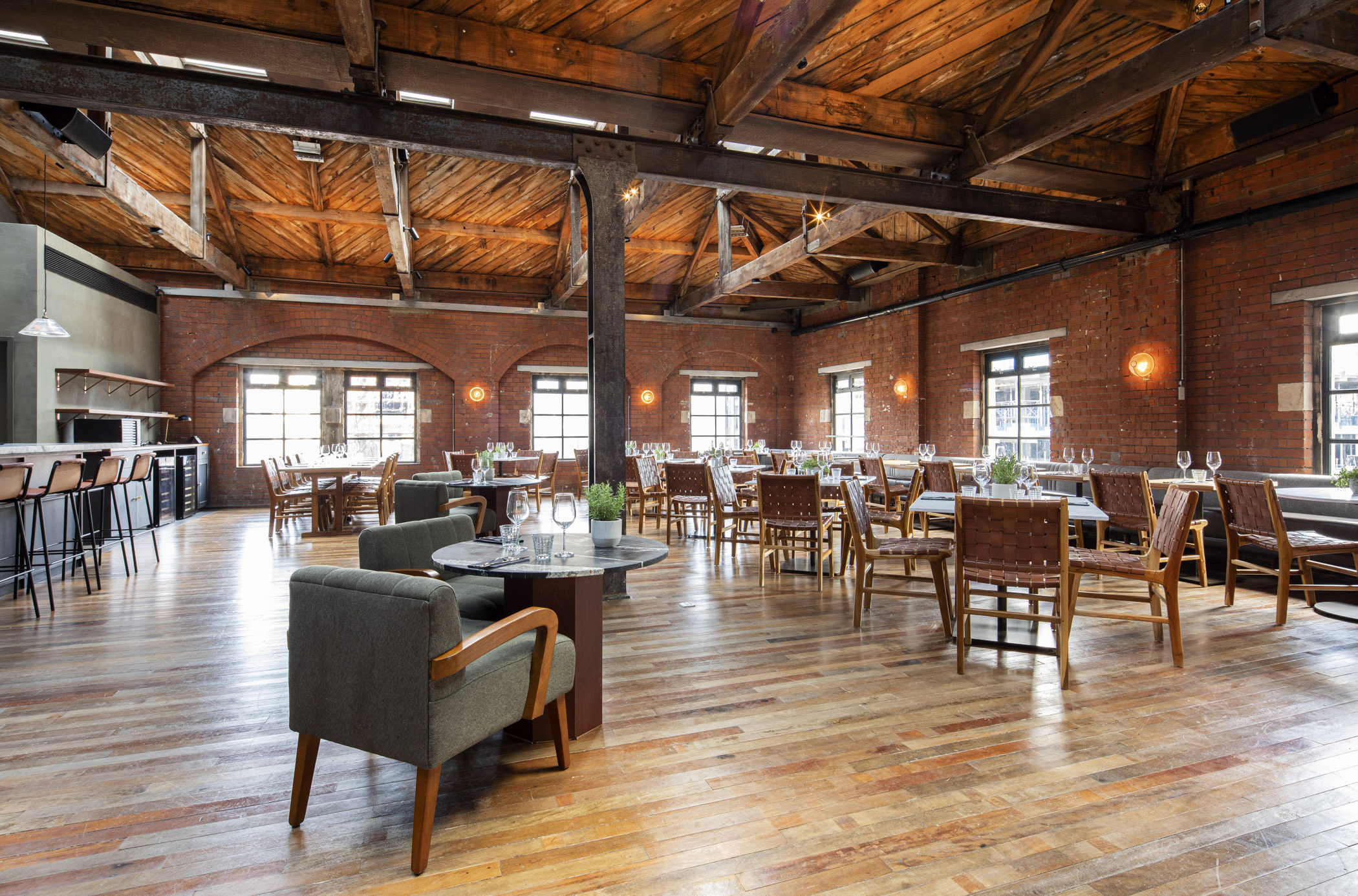 Spacious Timber Loft venue with exposed brick, perfect for events and receptions.