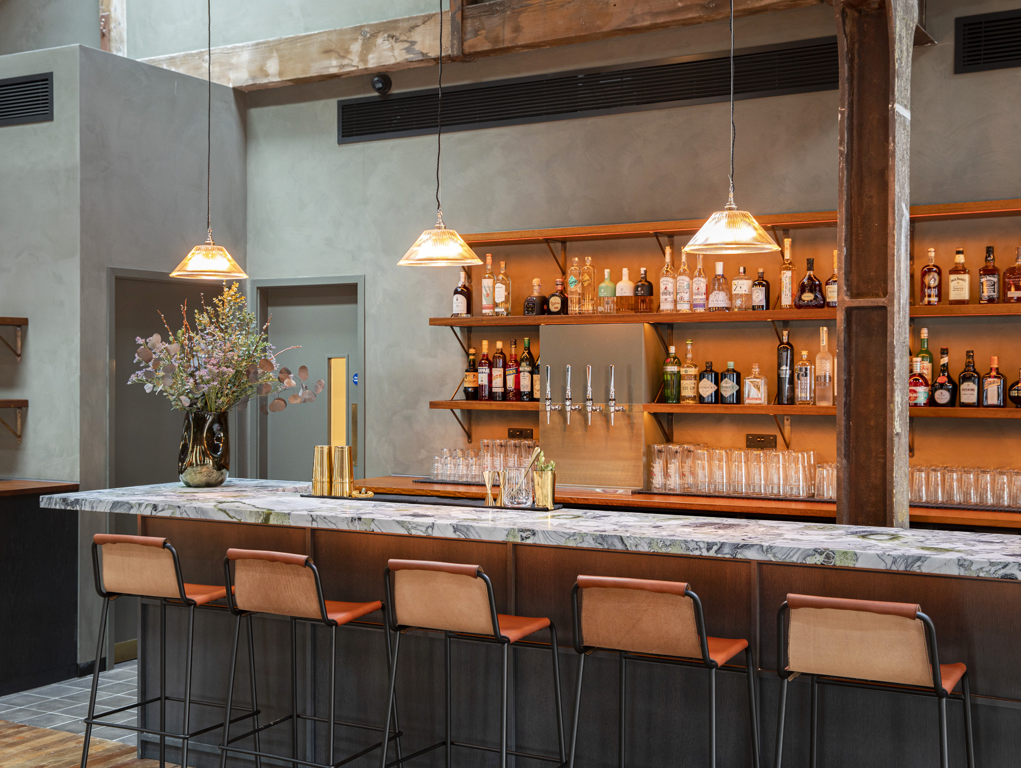 Stylish Timber Loft bar with warm lighting, ideal for networking events and cocktail receptions.