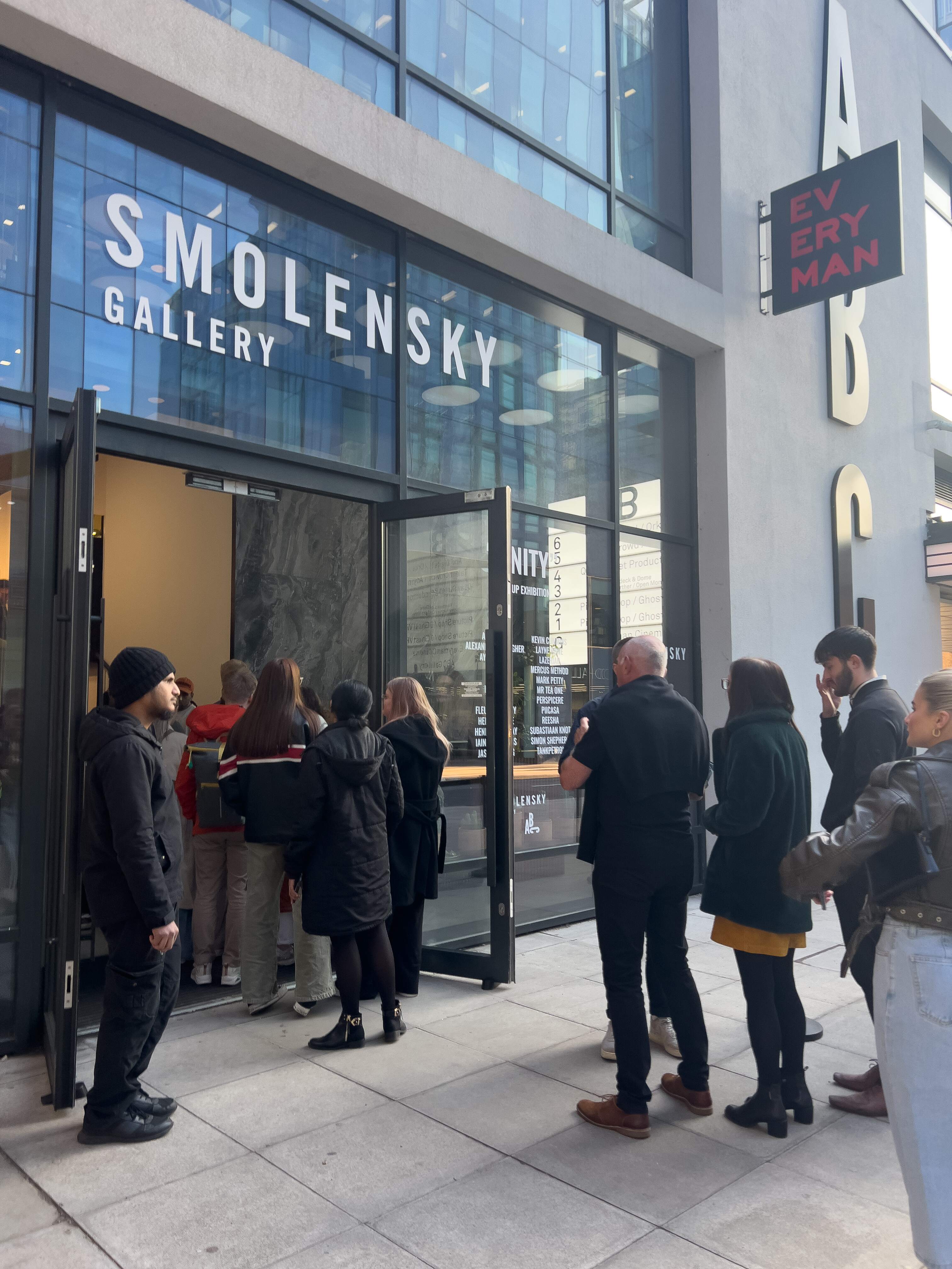 Attendees line up outside Smolensky Gallery for a secure event check-in in Manchester.