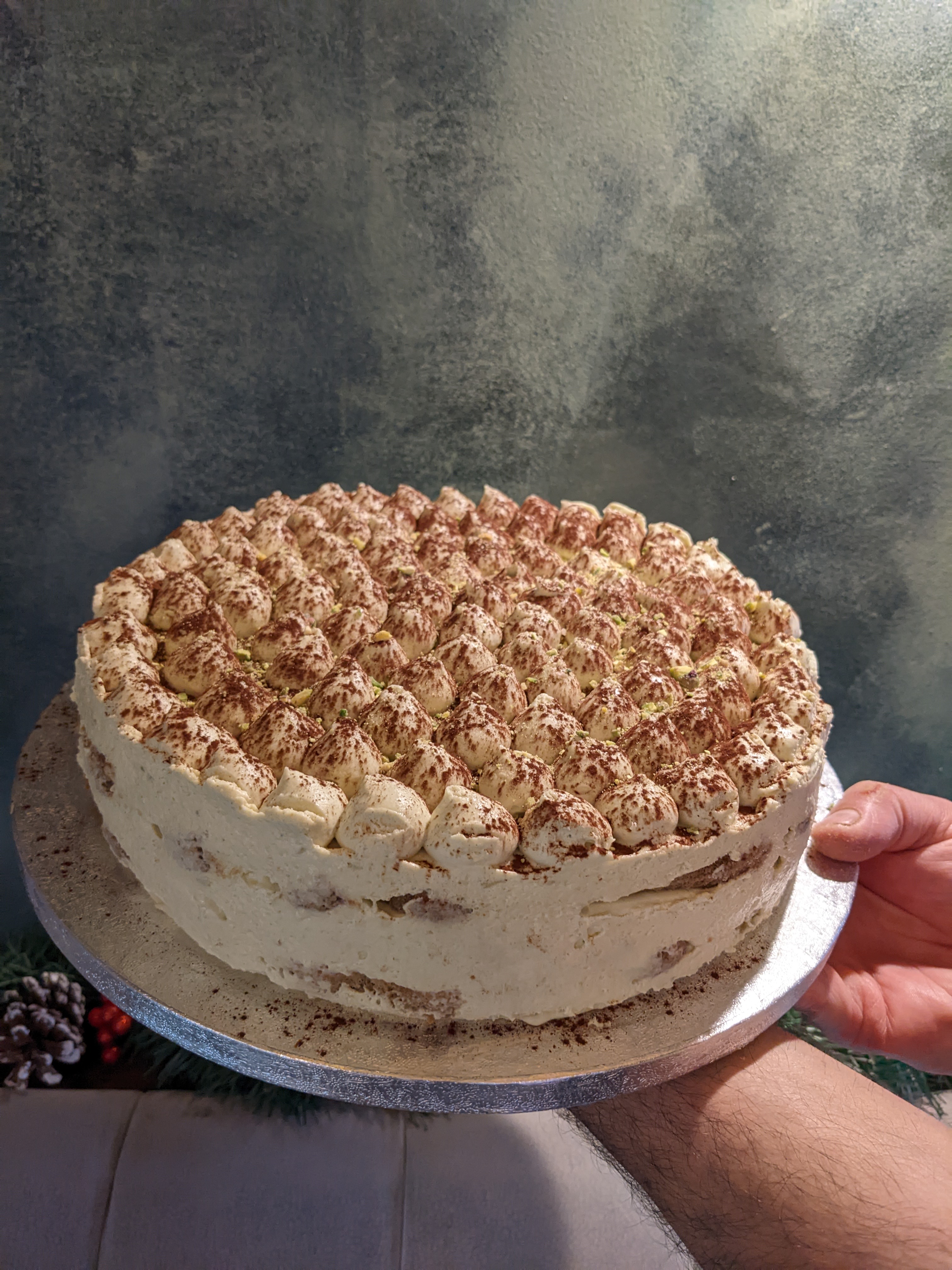 Elegant celebratory cake with intricate piping for weddings and corporate events.