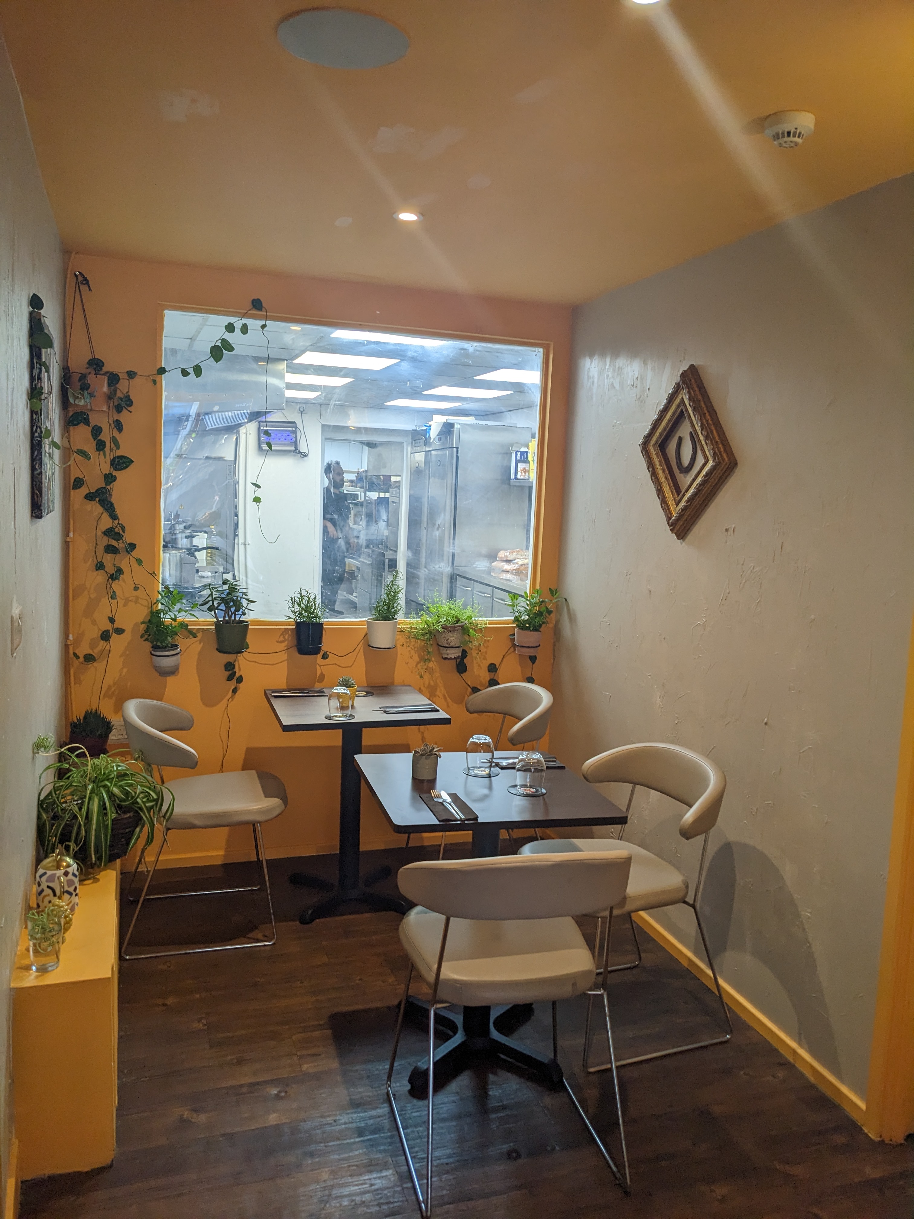 Cozy dining space at Tale ka Sicilian Bistro, ideal for meetings and casual gatherings.