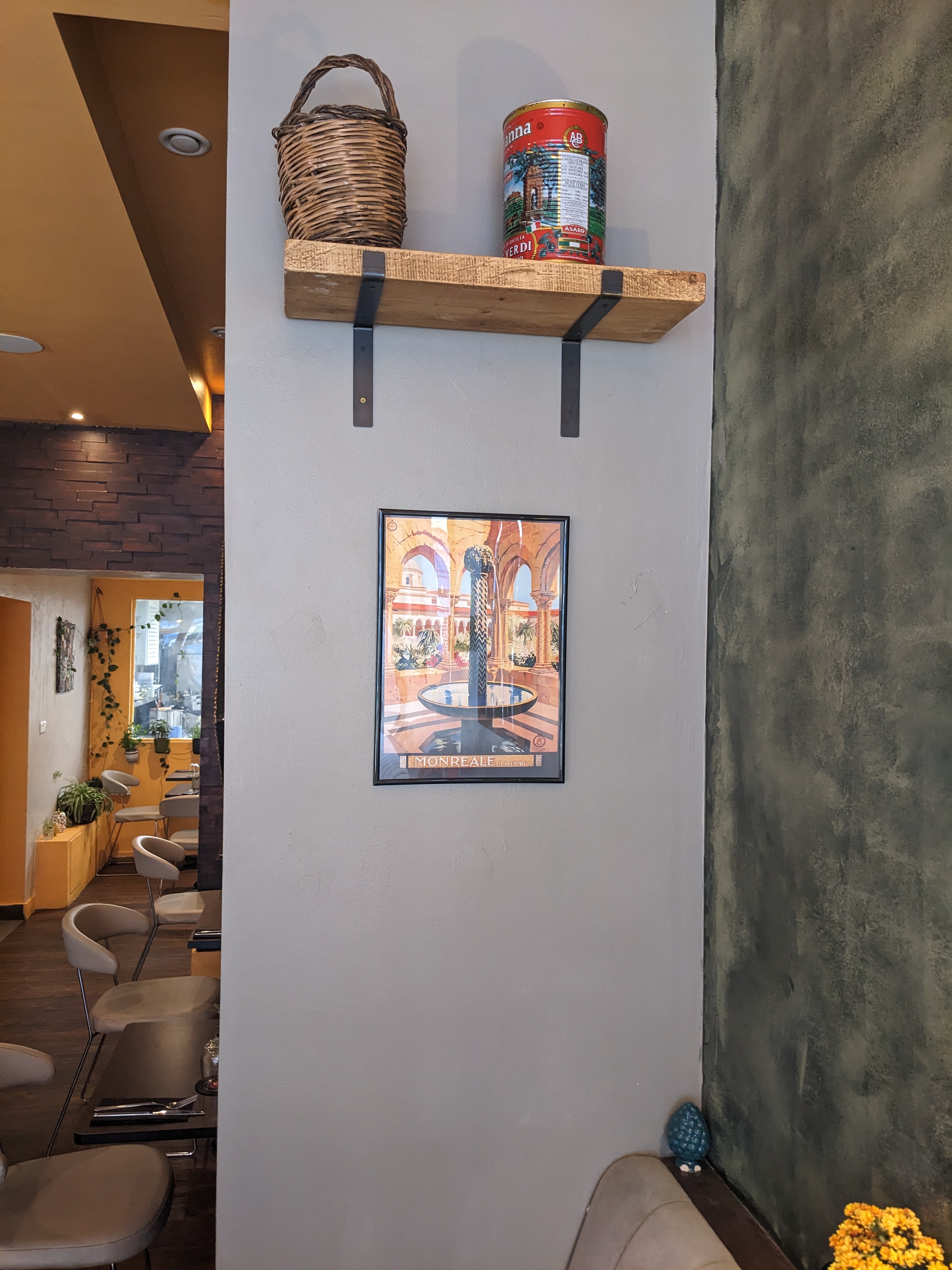 Framed artwork at Tale Ka Sicilian Bistro, perfect for events and networking.