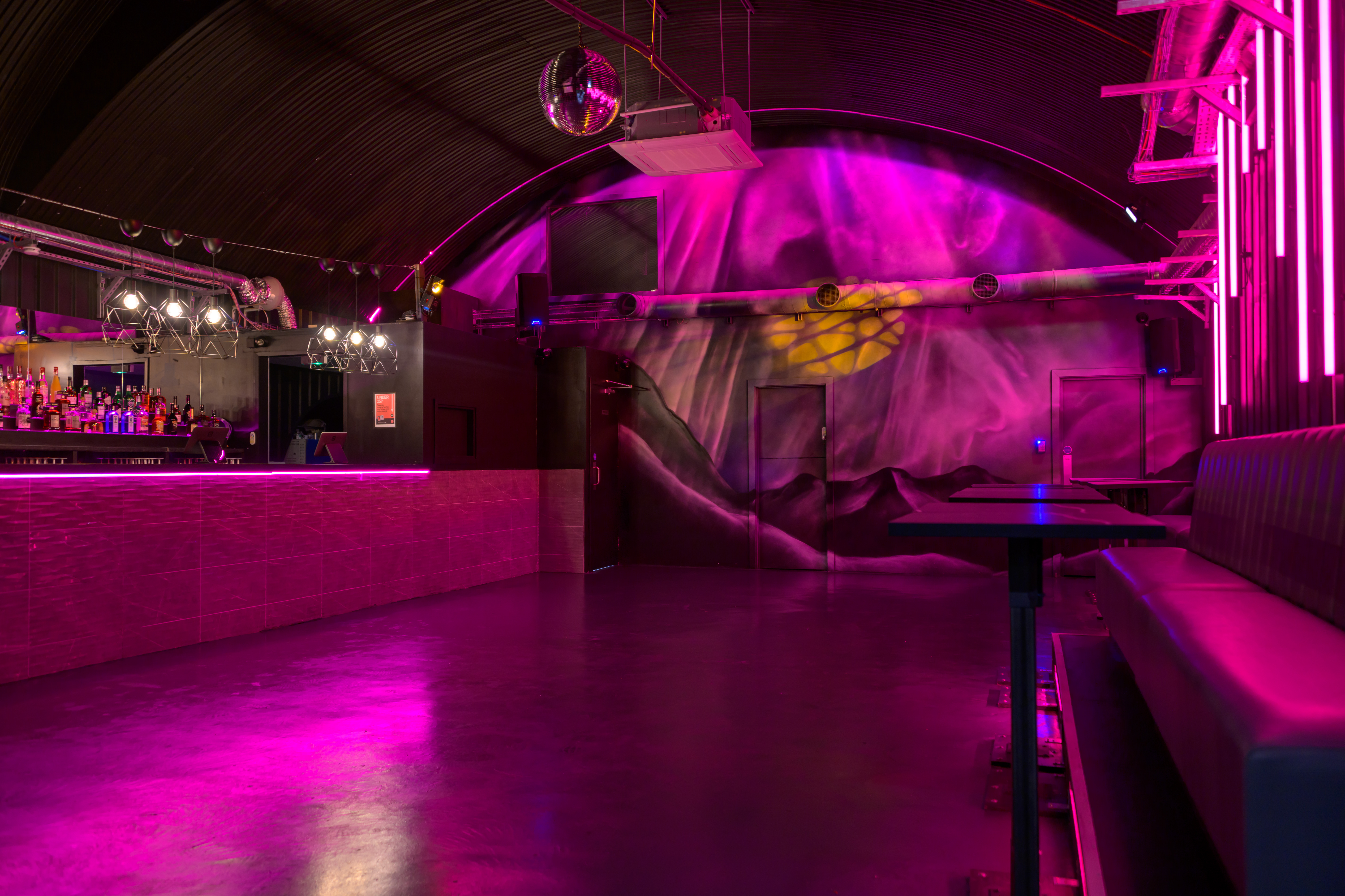 Vibrant event space in Alaska with modern design, ideal for nightlife and gatherings.