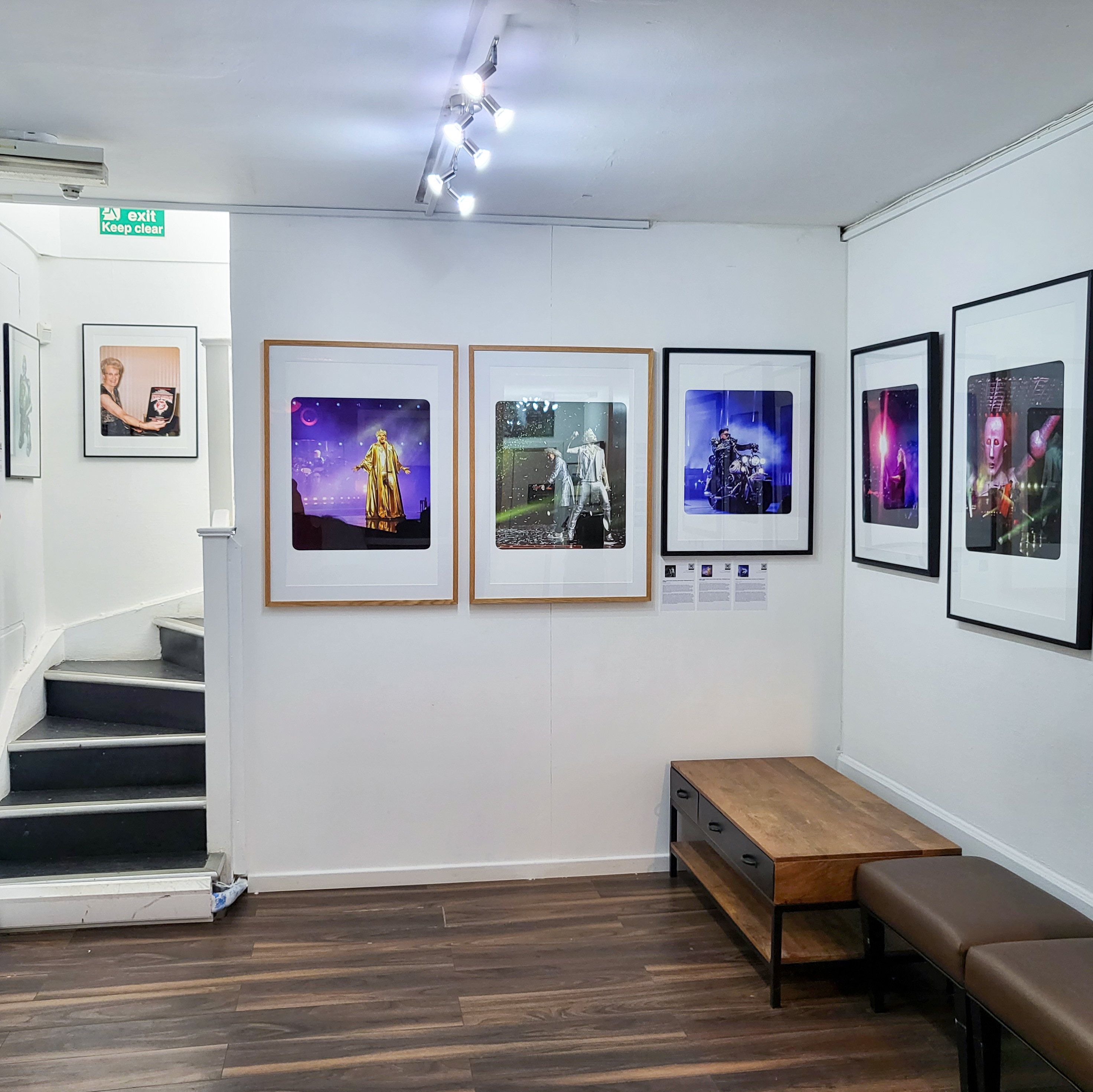 Gallery space with framed performance photos, ideal for networking events and workshops.