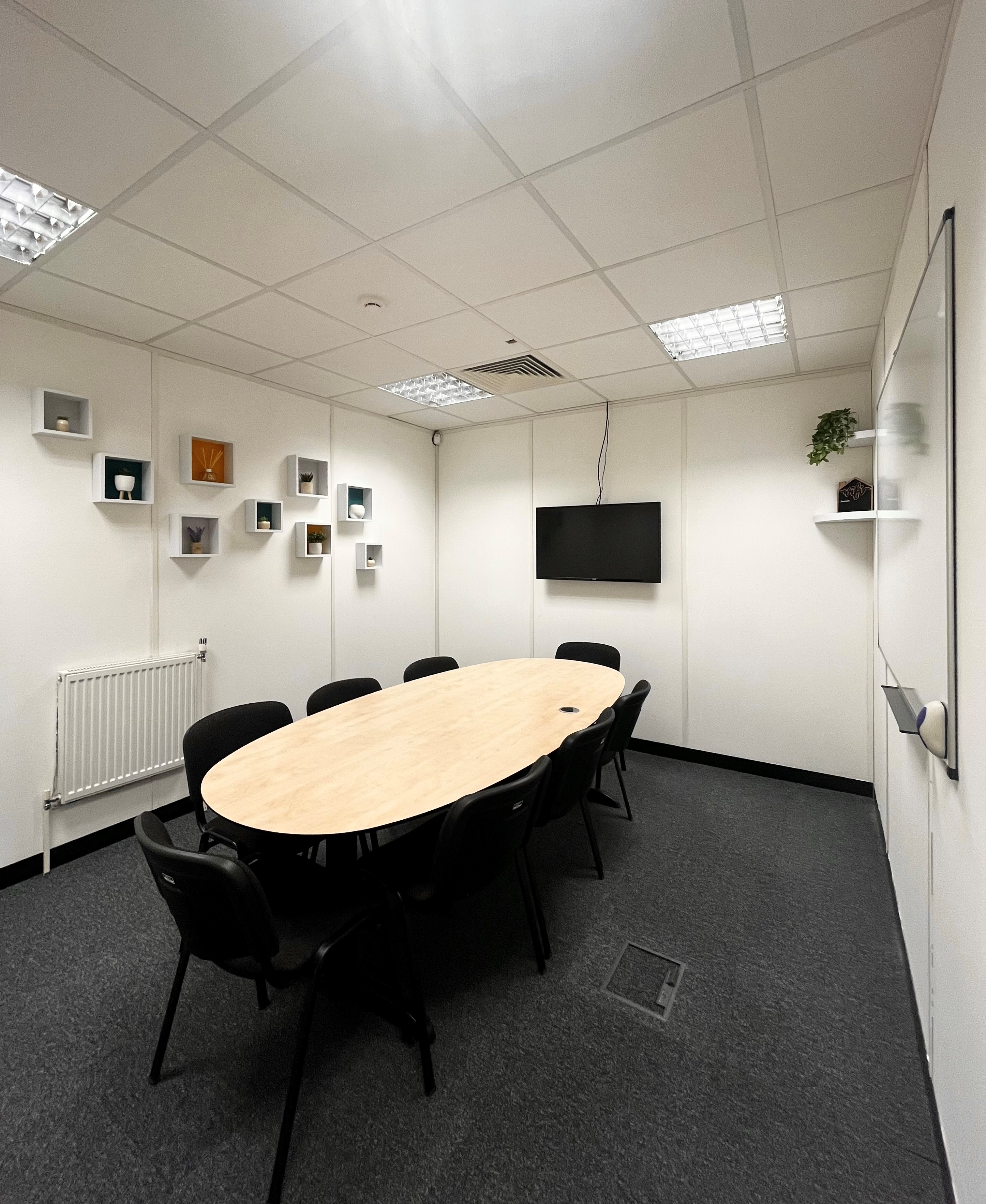 Mersey suite at UBC Thursby House, modern meeting room with oval table for discussions.