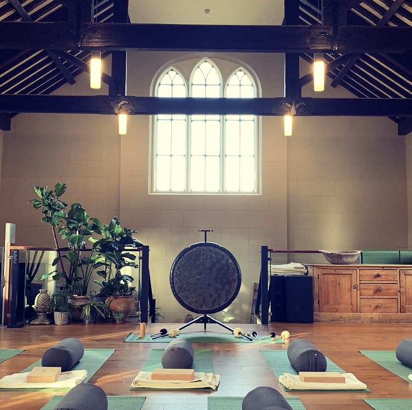 Serene event space at The Oak House Studio with large gong, perfect for wellness retreats.
