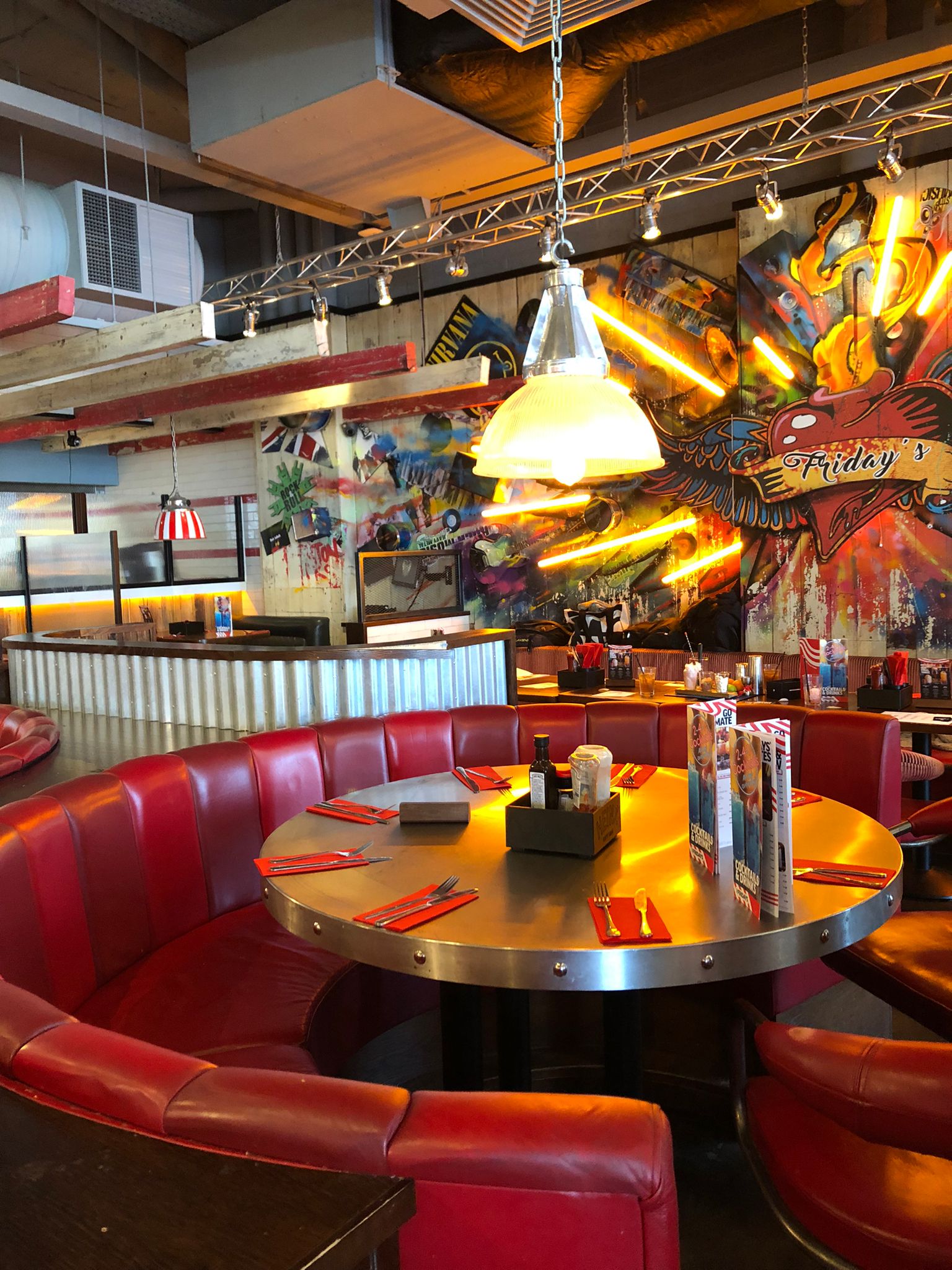 Vibrant TGI Friday's venue with colorful decor, perfect for casual meetings and events.