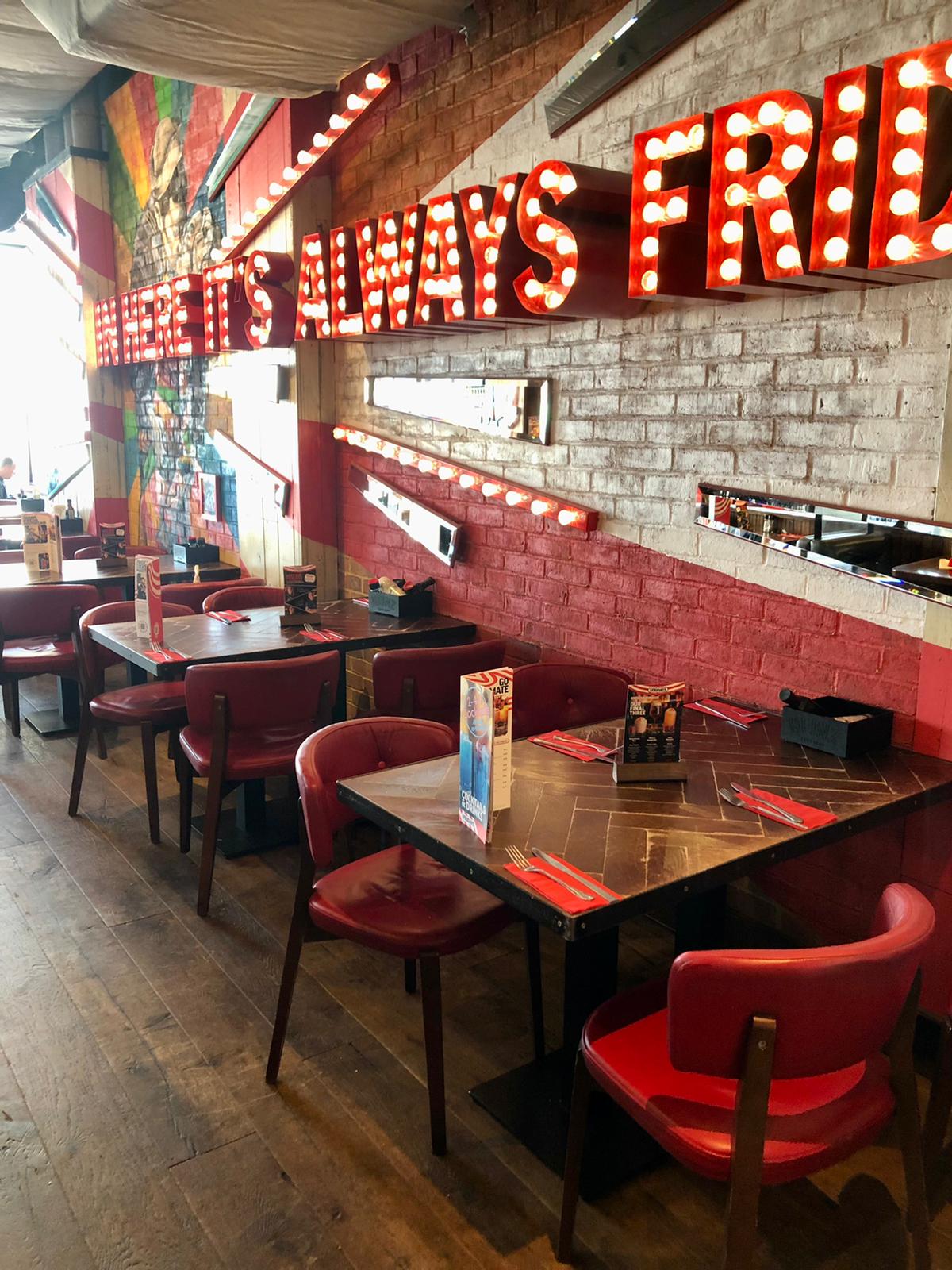 Semi-private dining area at TGI Friday's Brighton Marina, perfect for casual meetings and events.