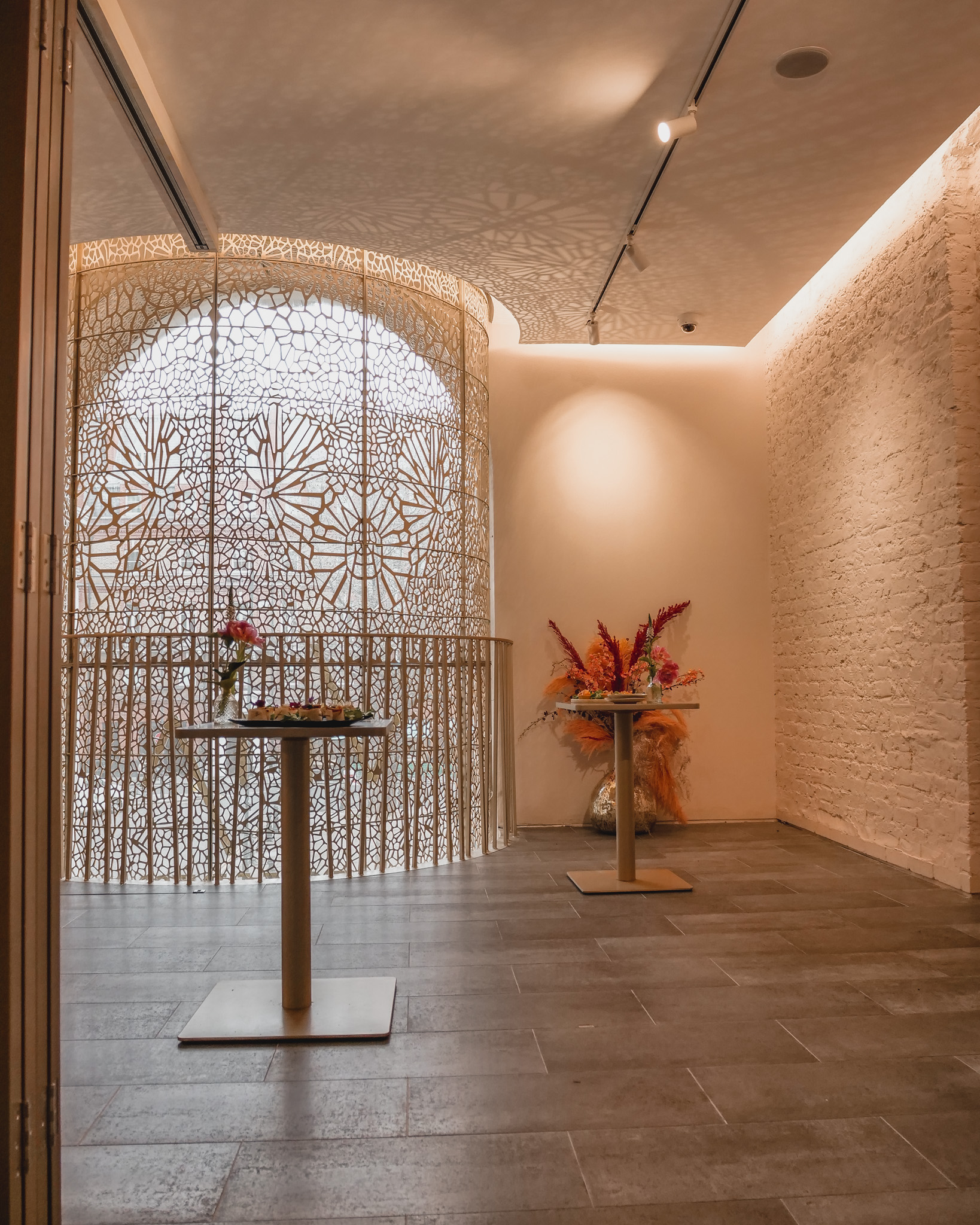 Elegant event space at Sunrise Studio with floral arrangements for gatherings.