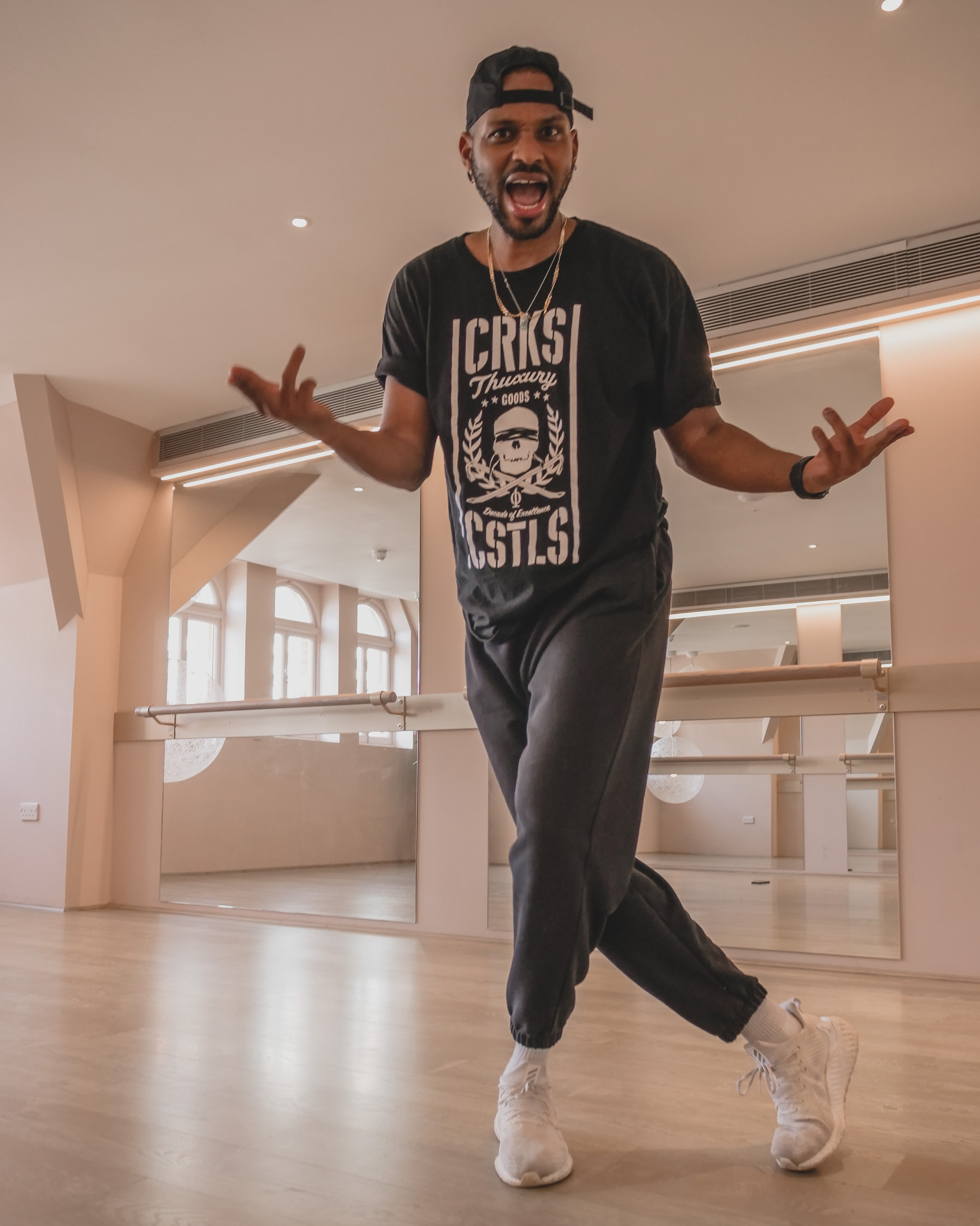 Energetic speaker engaging audience at Vita Boutique Fitness workshop.