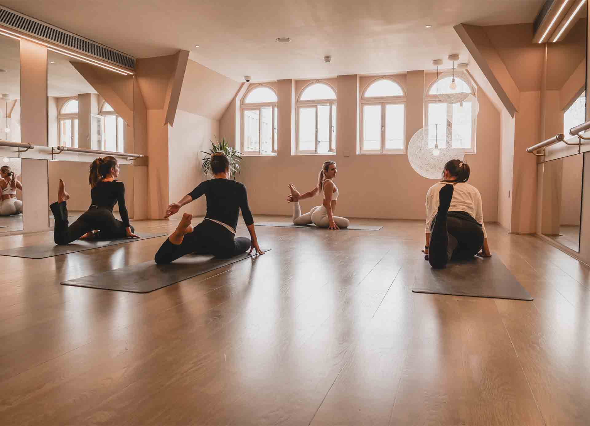 Serene yoga studio with natural light, ideal for wellness retreats and team-building events.