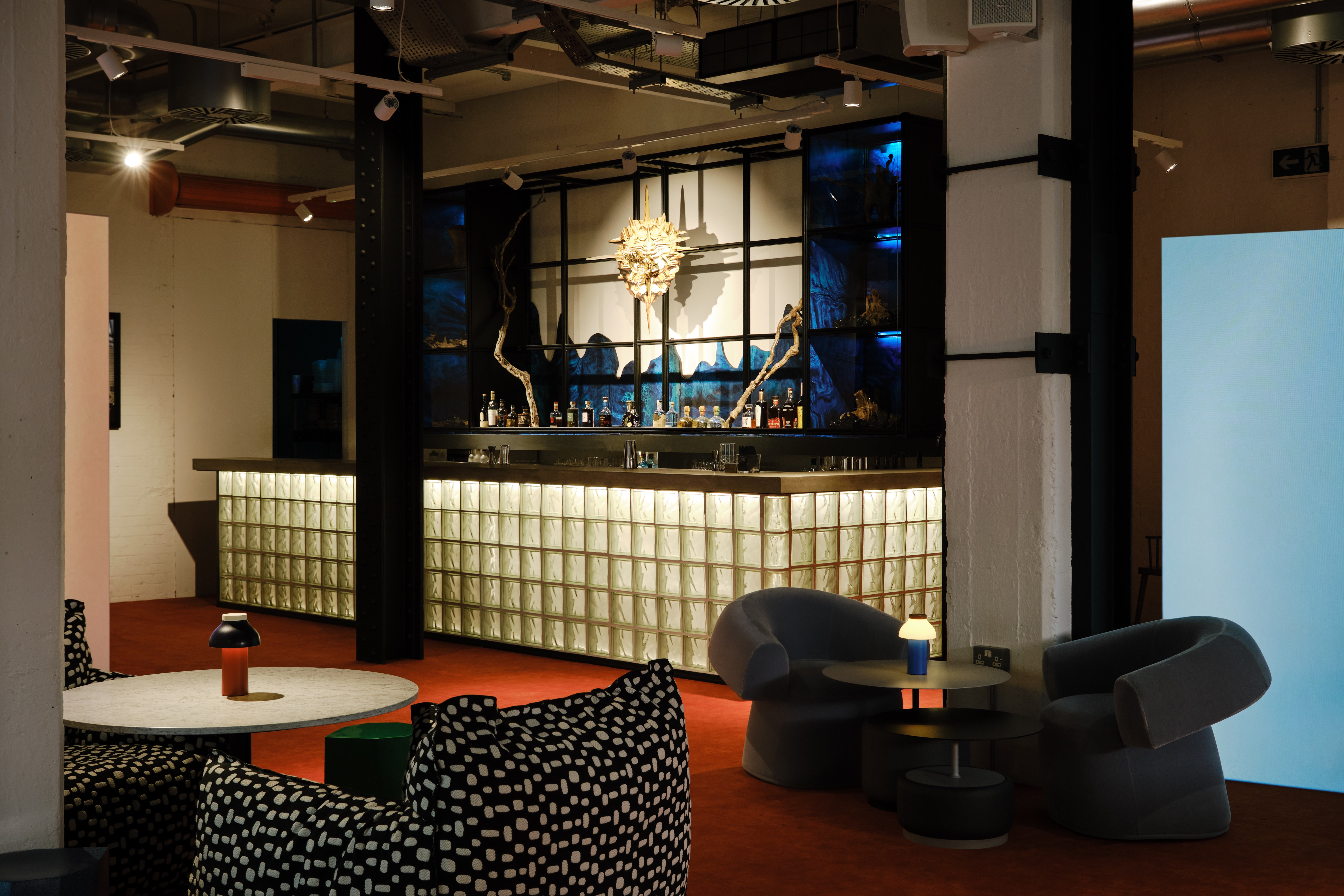 Modern Shoreditch Arts Club lounge with stylish bar, perfect for networking events.