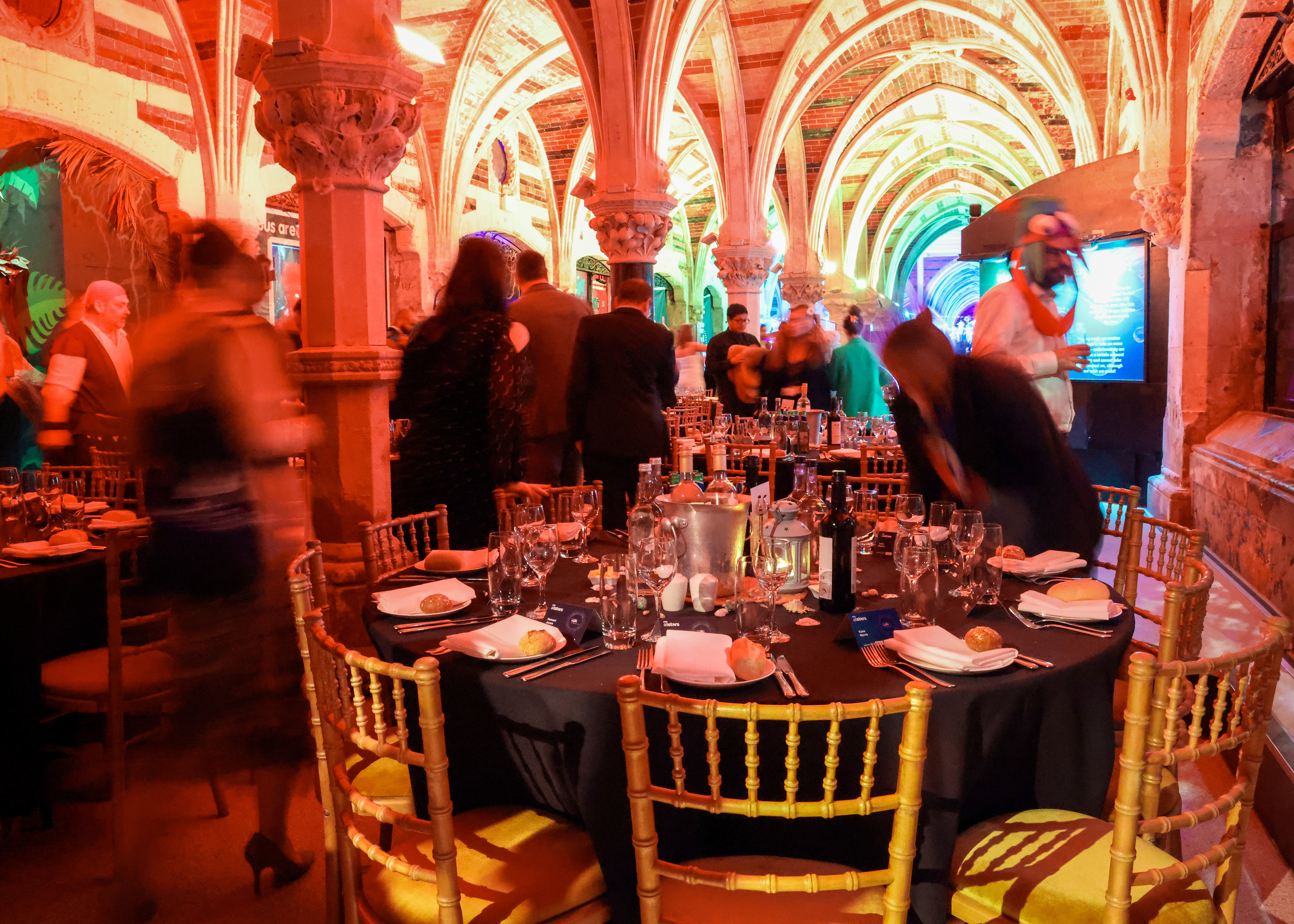 Elegant dining setup at SEA LIFE Brighton for a vibrant networking event.