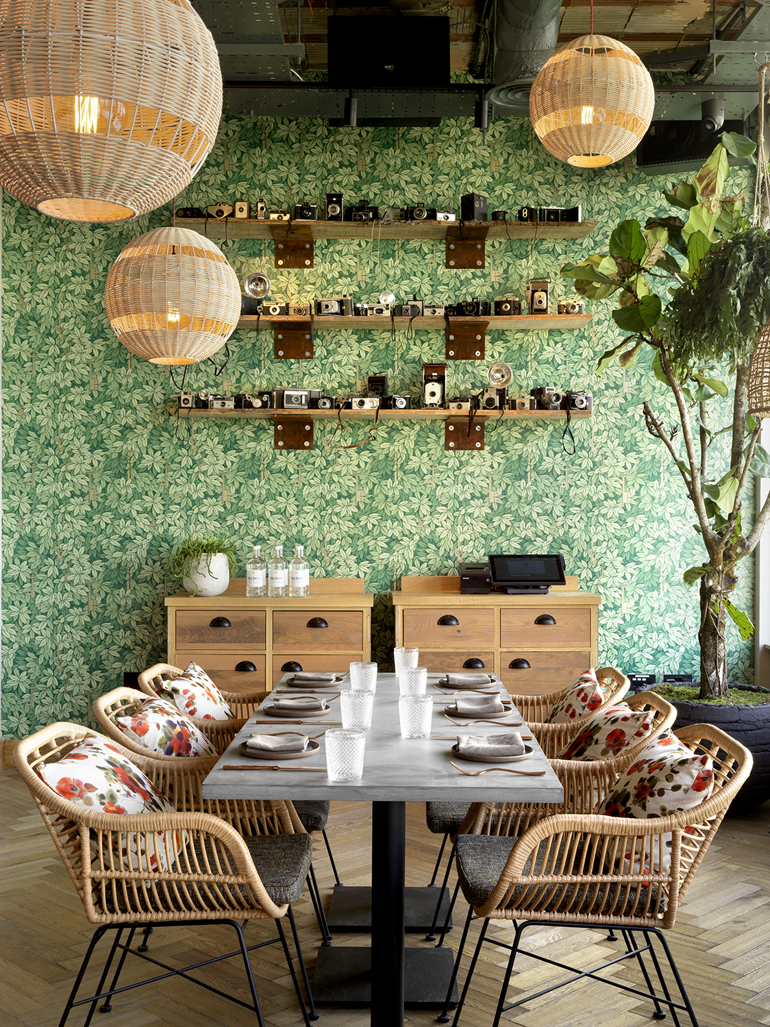 Stylish meeting space with floral wallpaper at The Treehouse Hotel for intimate events.