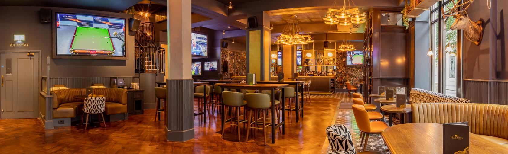 Stylish event venue with modern decor and inviting atmosphere in Goldwood Spots Pub.