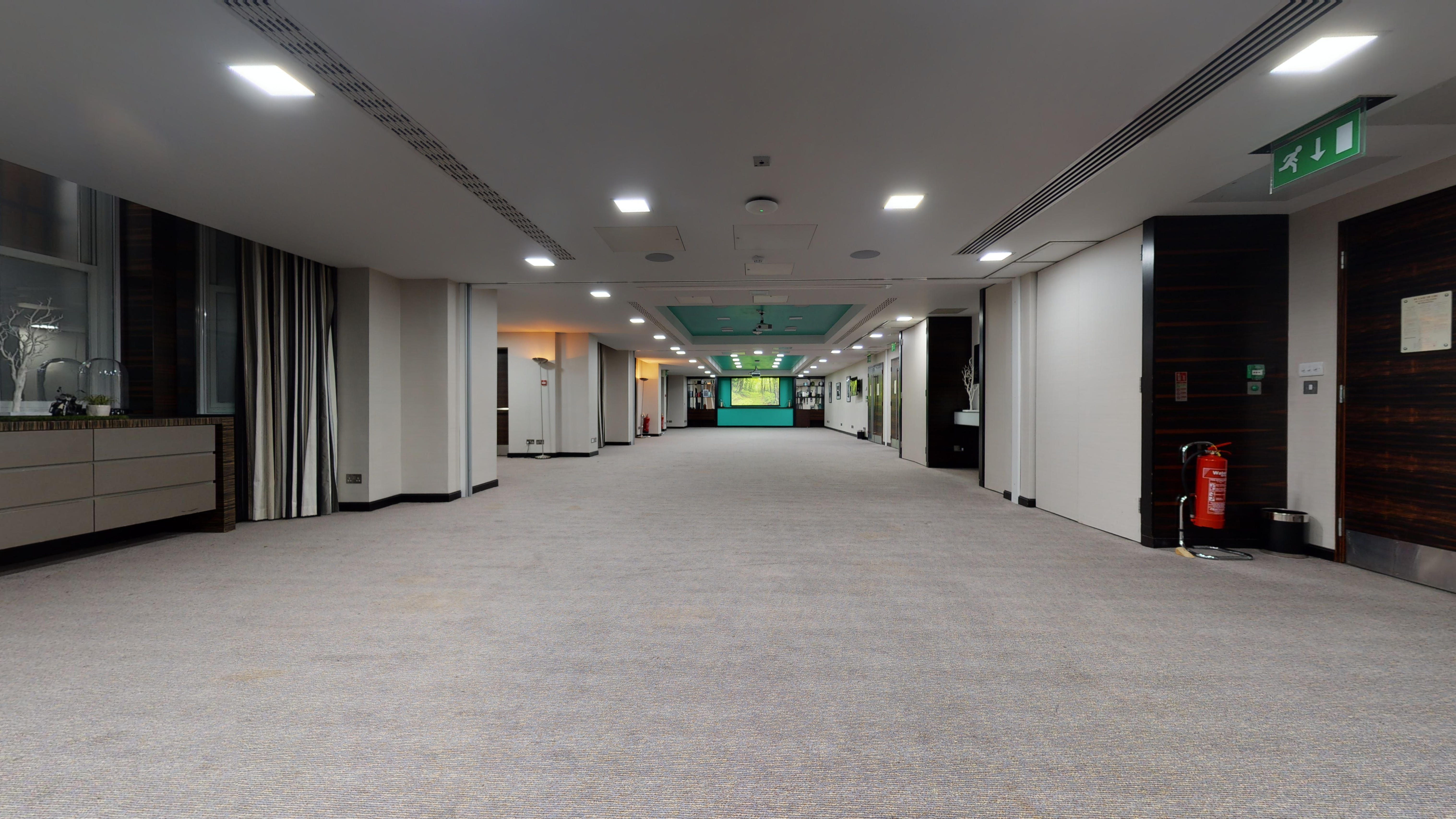 Spacious corridor at DoubleTree London Kensington, ideal for conferences and events.