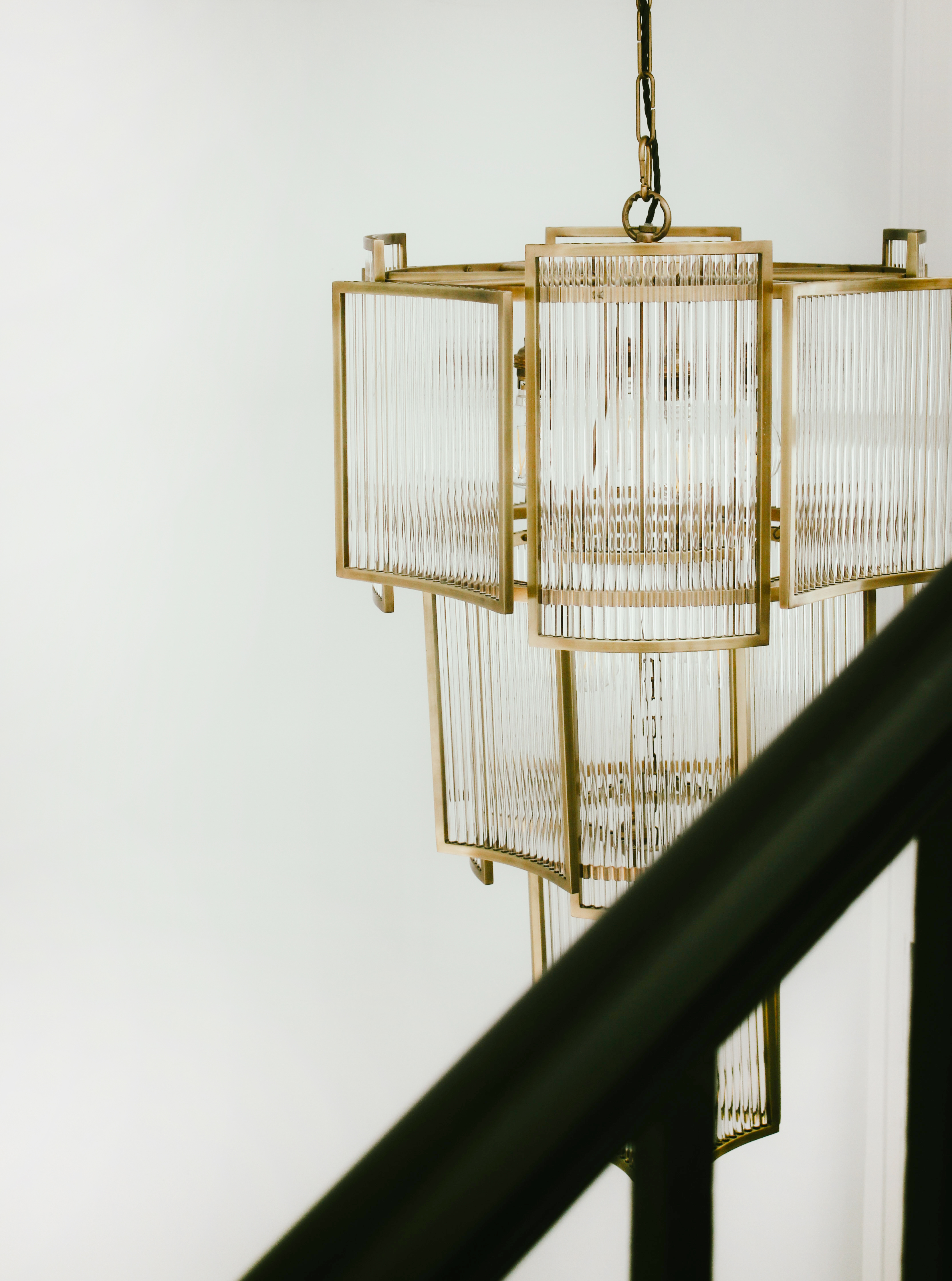 Modern geometric chandelier with gold accents for elegant corporate events.