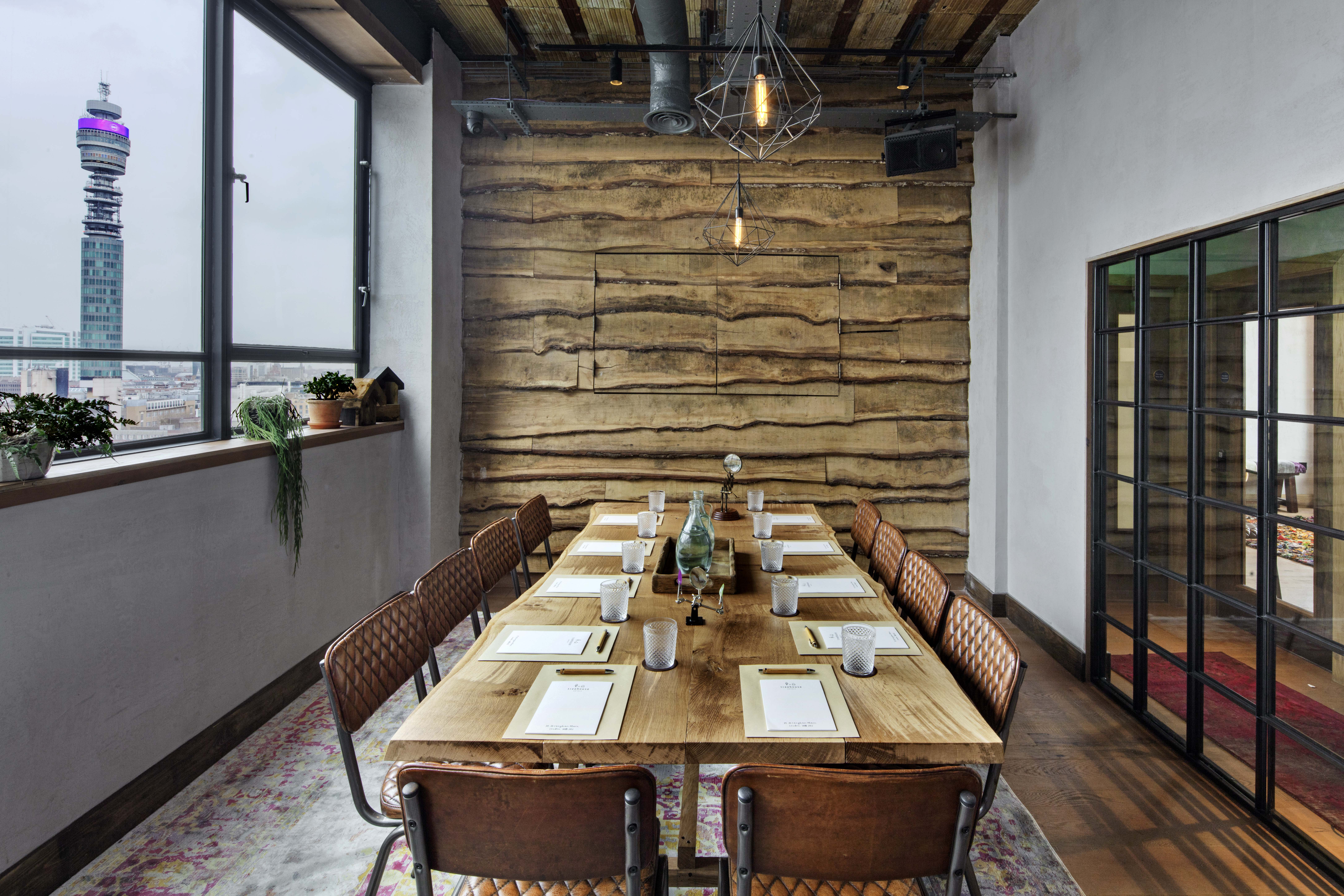 Stylish meeting room with wooden table at The Treehouse Hotel for upscale events.
