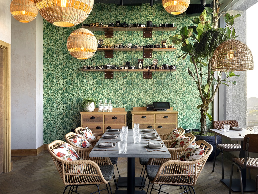 Madera Semi-Private dining space with floral wallpaper for intimate meetings and events.