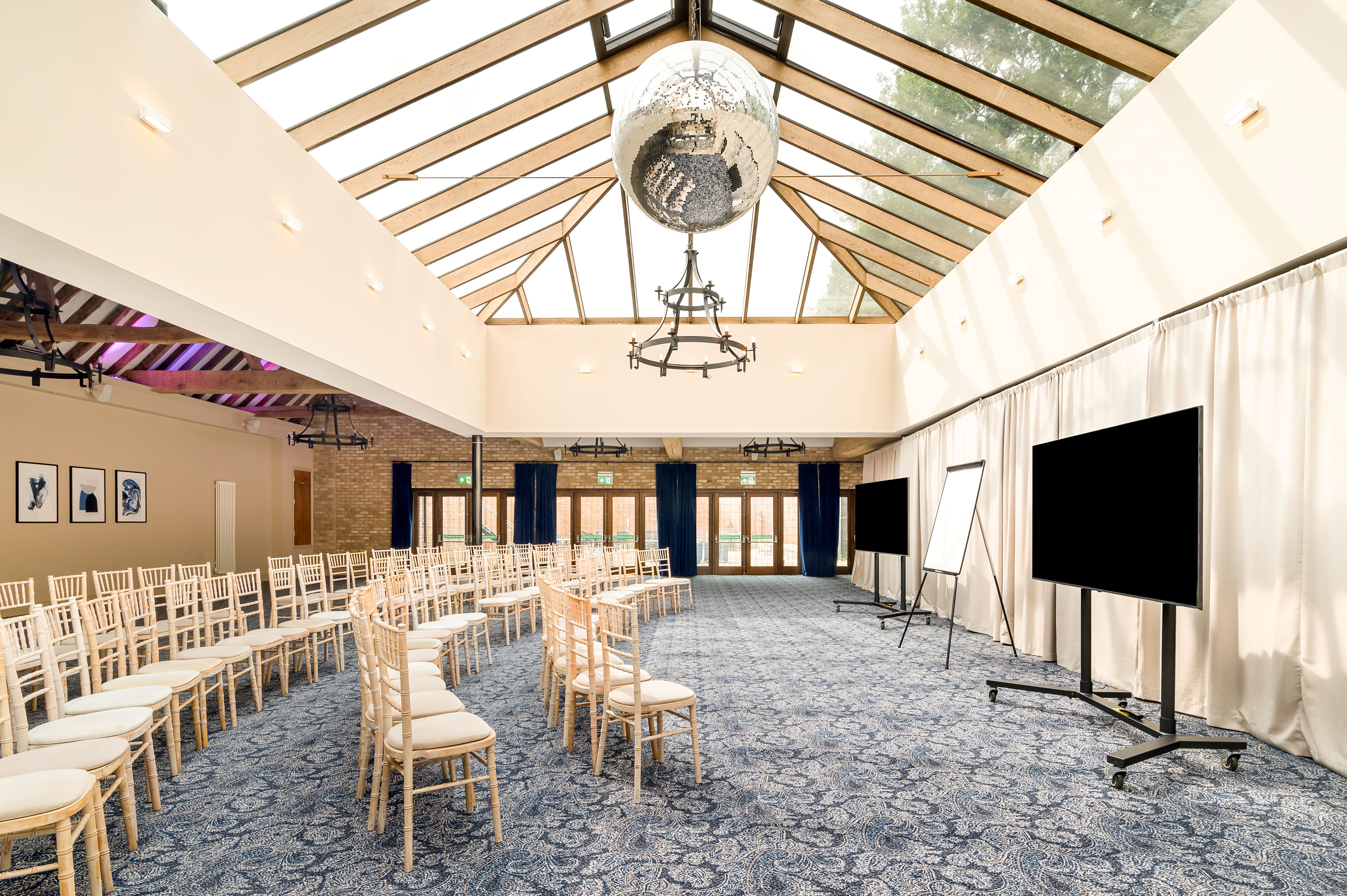 Hazel Suite at Voco Lythe Hill: elegant event space for meetings and workshops.