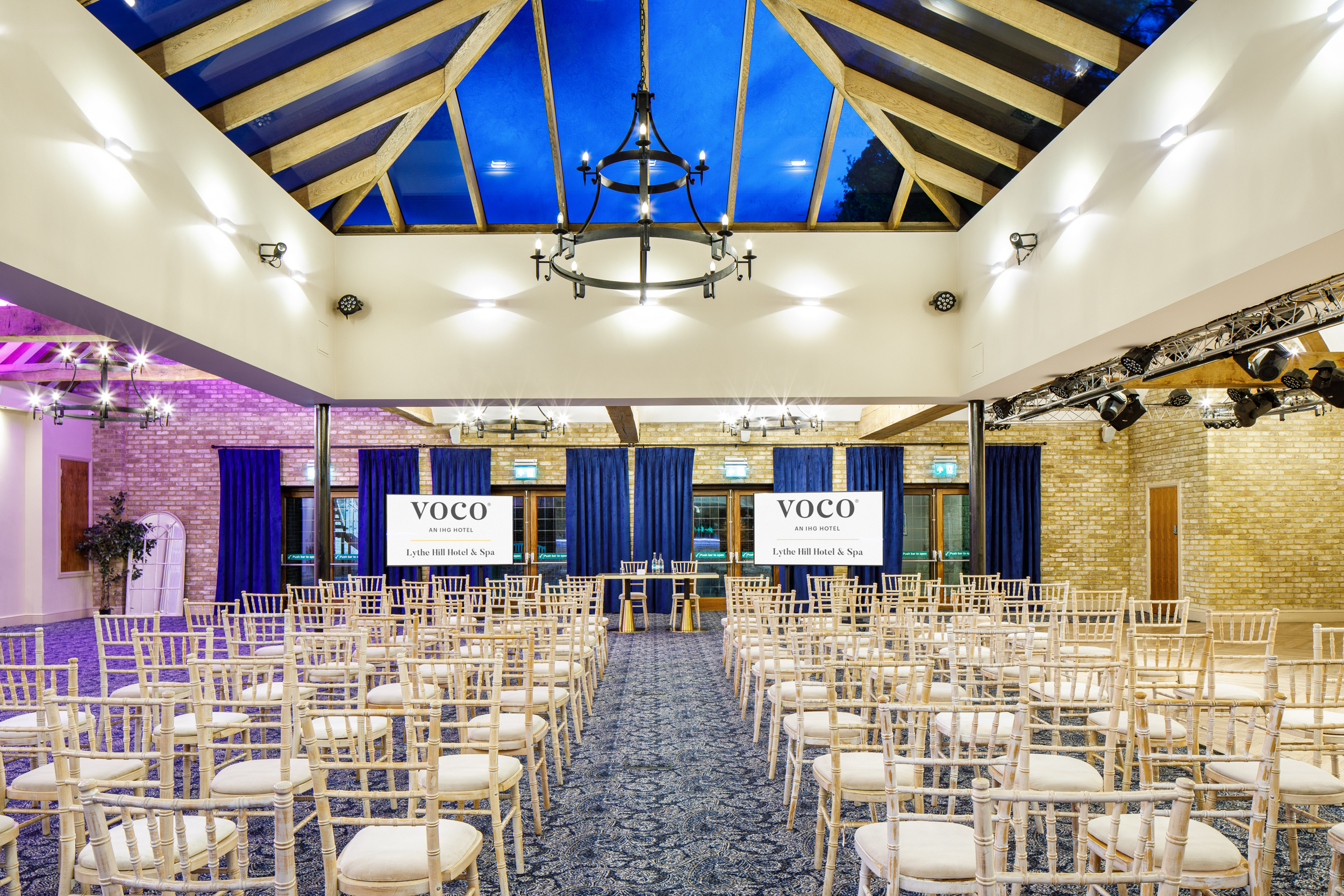 Hazel Suite at Voco Lythe Hill: elegant corporate event space with natural light.