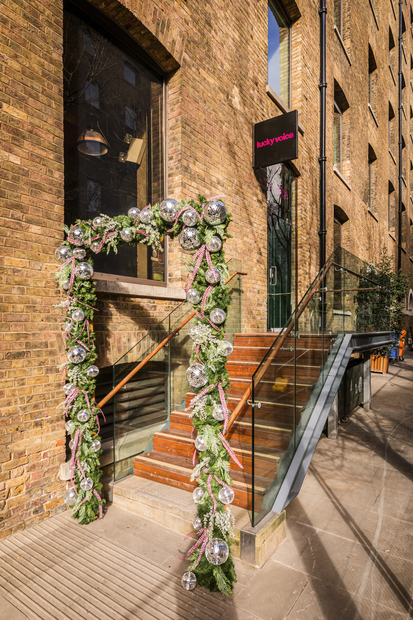 Private karaoke room entrance with festive arch, ideal for seasonal celebrations.