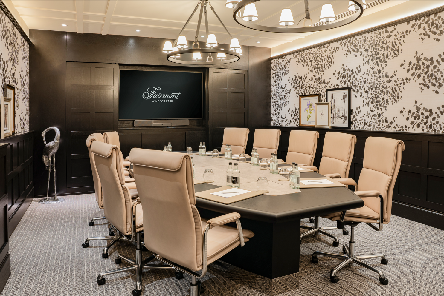Sophisticated meeting room with large table at Fairmont Windsor Park for corporate events.