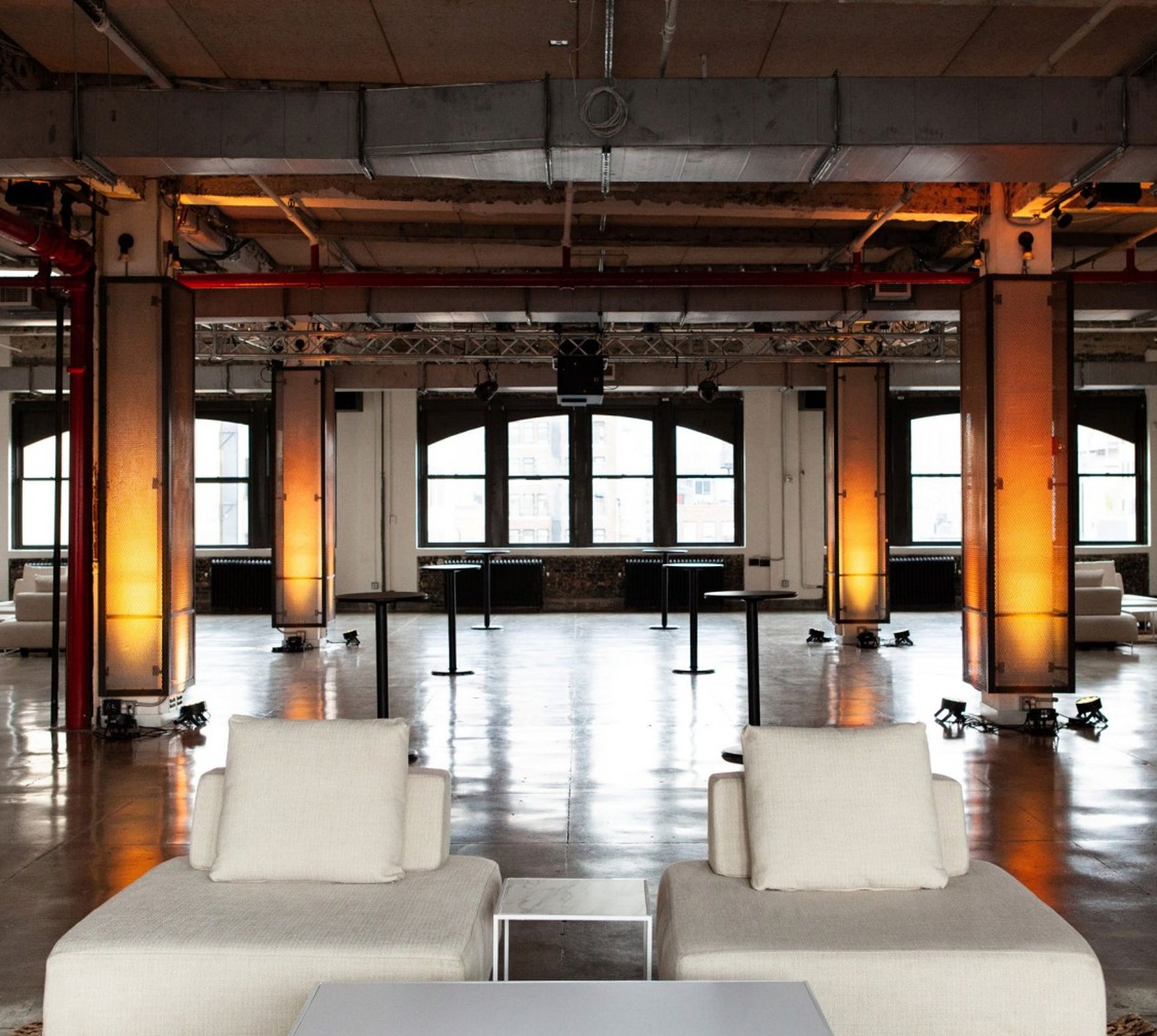 Spacious event venue with modern decor at NeueHouse Madison Square for networking and gatherings.