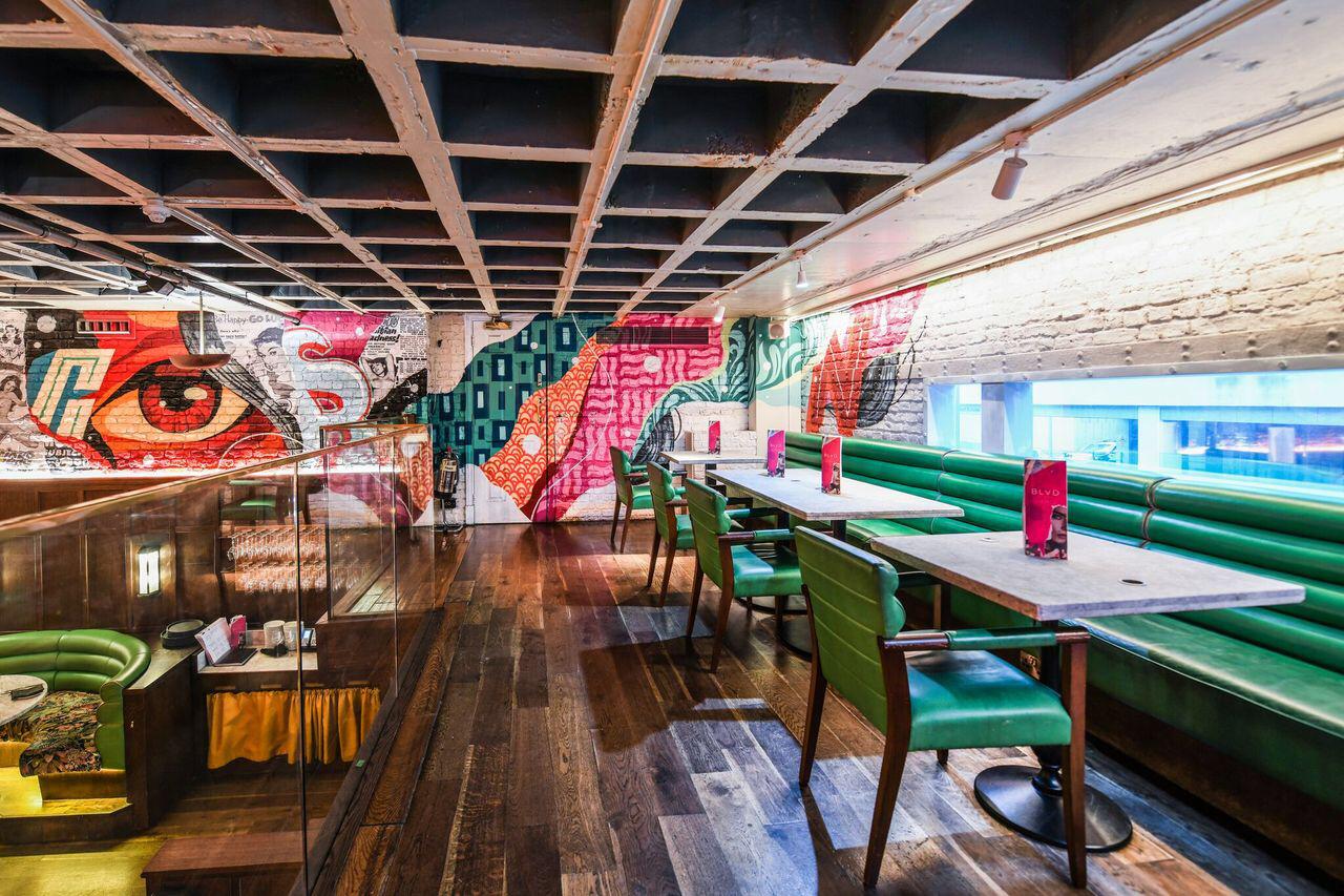 Vibrant BLVD Spinningfields restaurant with colorful mural for casual meetings and networking.