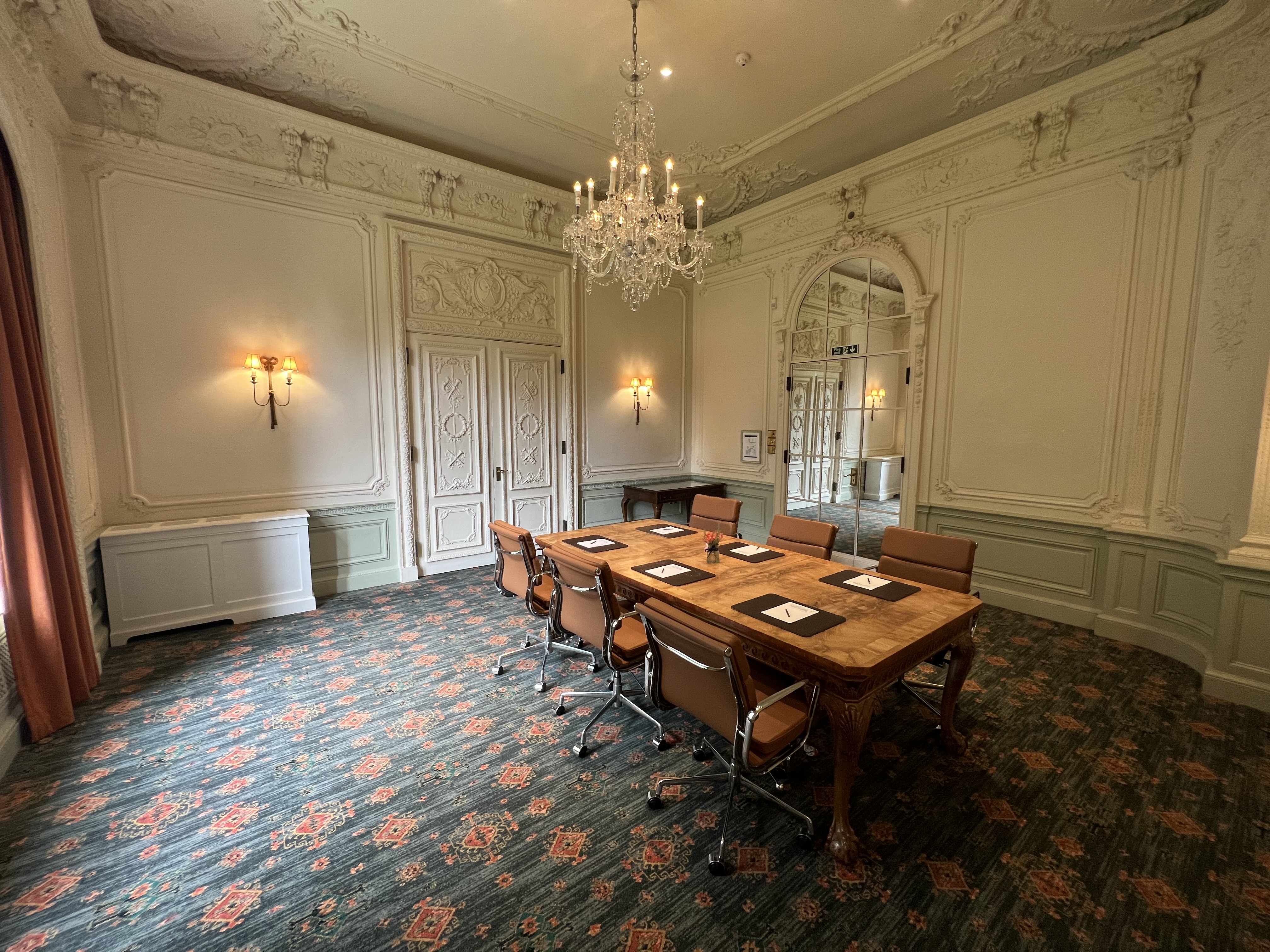 Elegant meeting room with wooden table at Warren House Hotel, perfect for executive gatherings.
