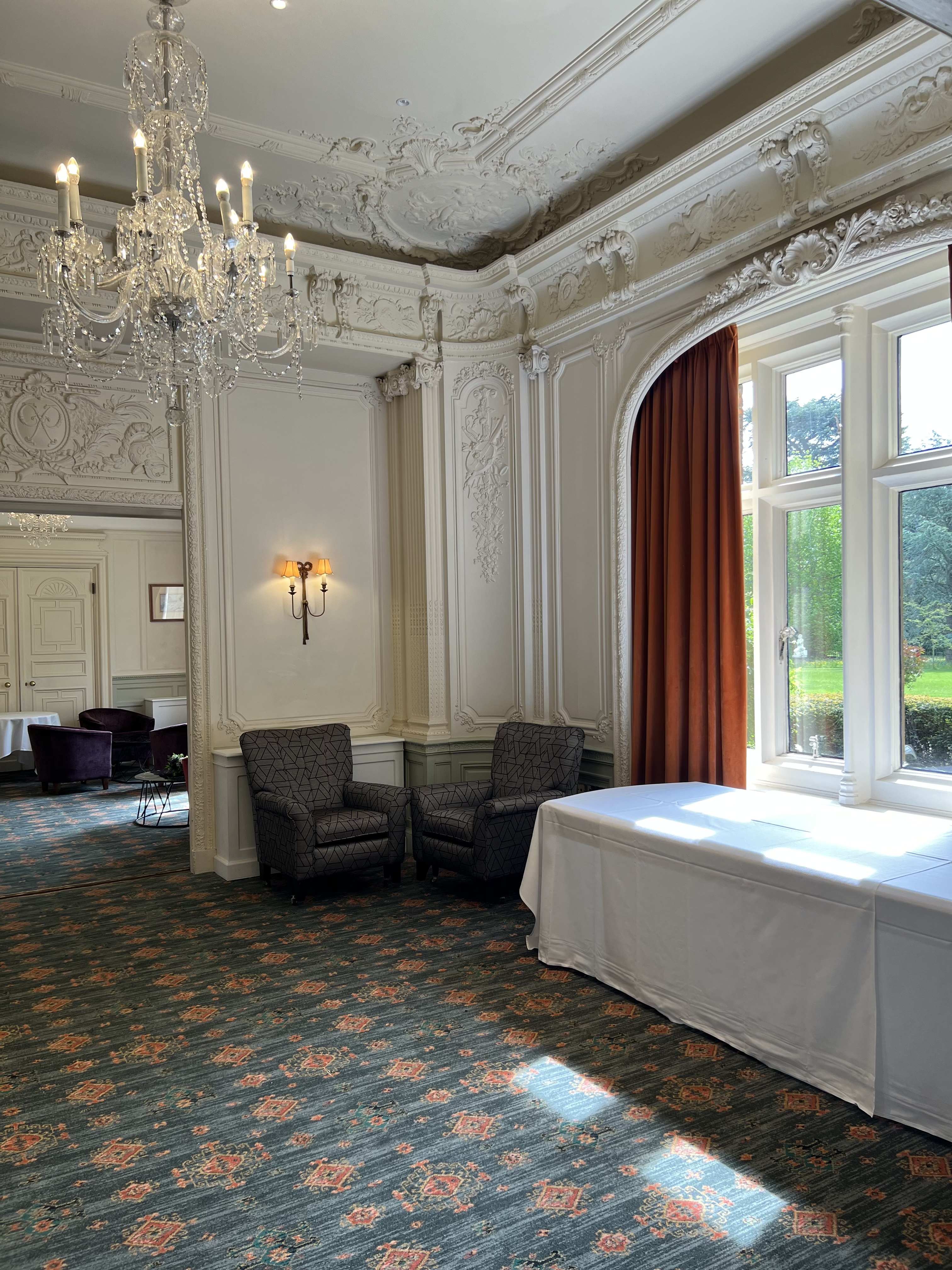 Elegant meeting space with natural light at Warren House Hotel, ideal for gatherings.